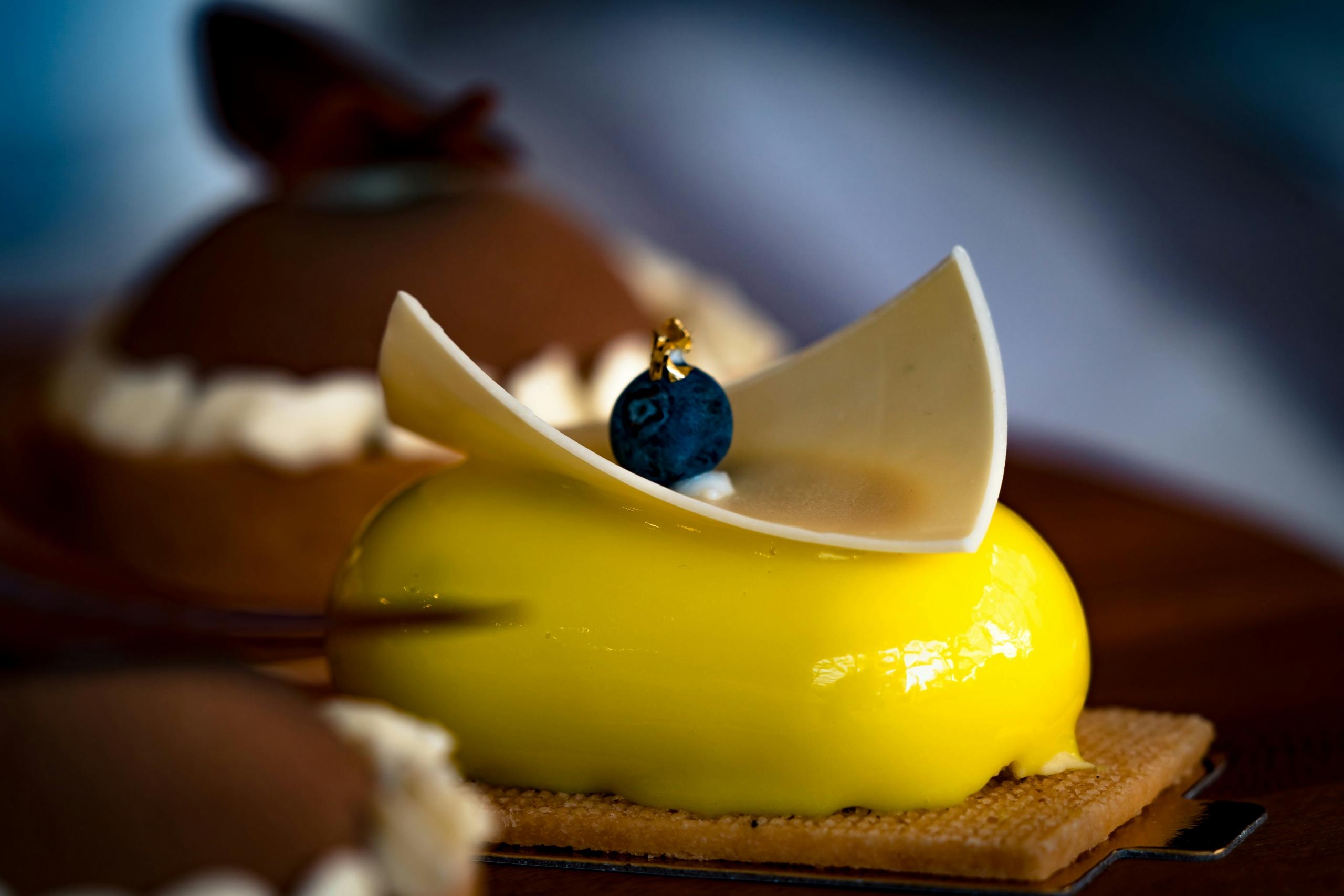 yellow-and-brown-cake-on-brown-wooden-table-