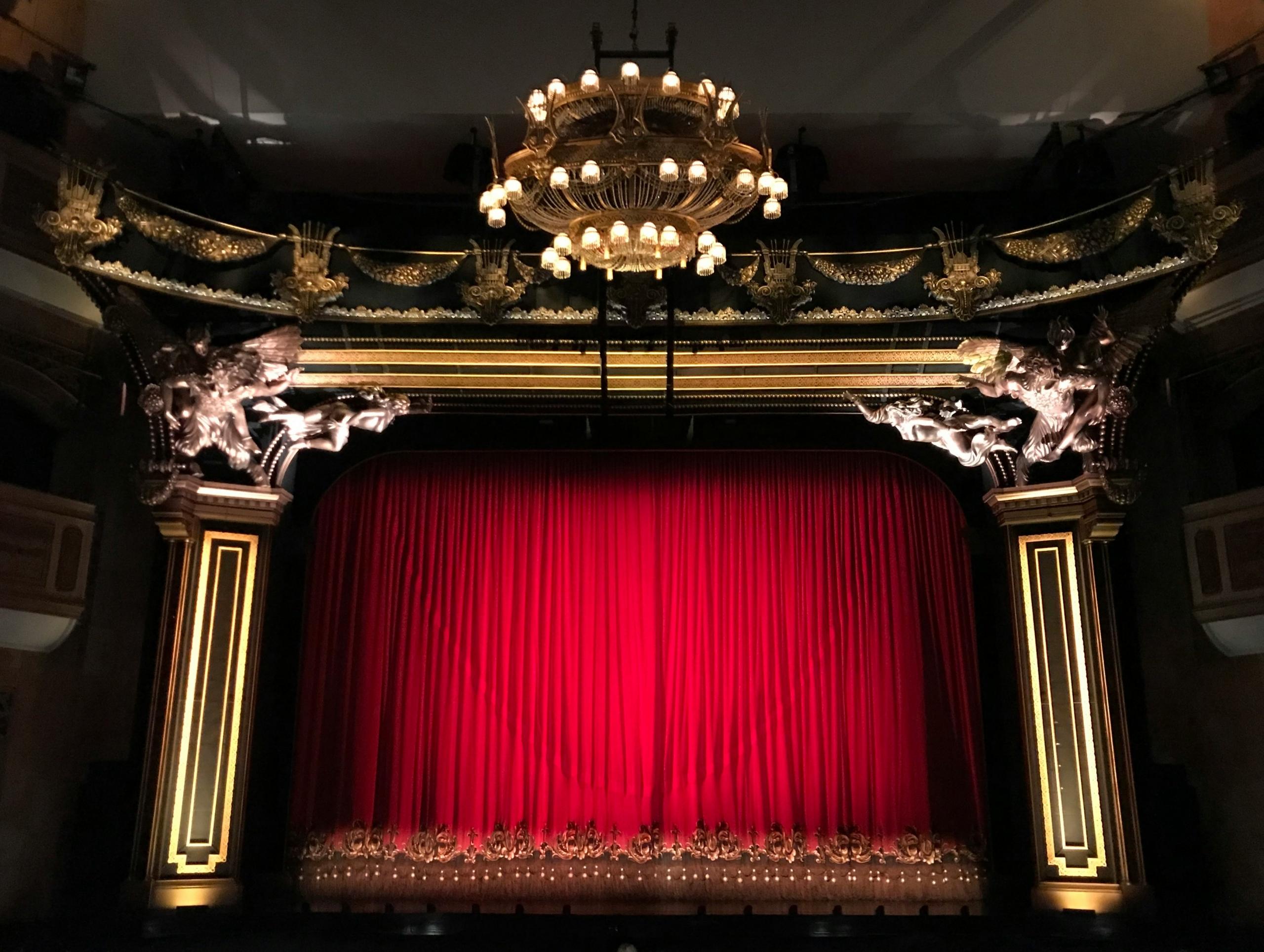 red velvet stage curtain in baroque theatre
