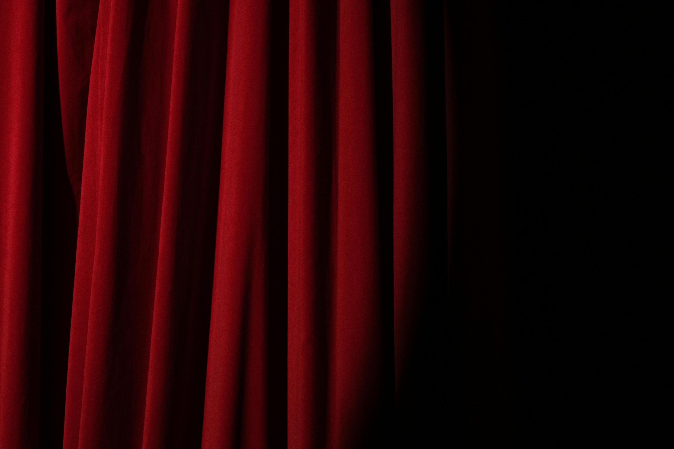 closed red velvet theatre curtain