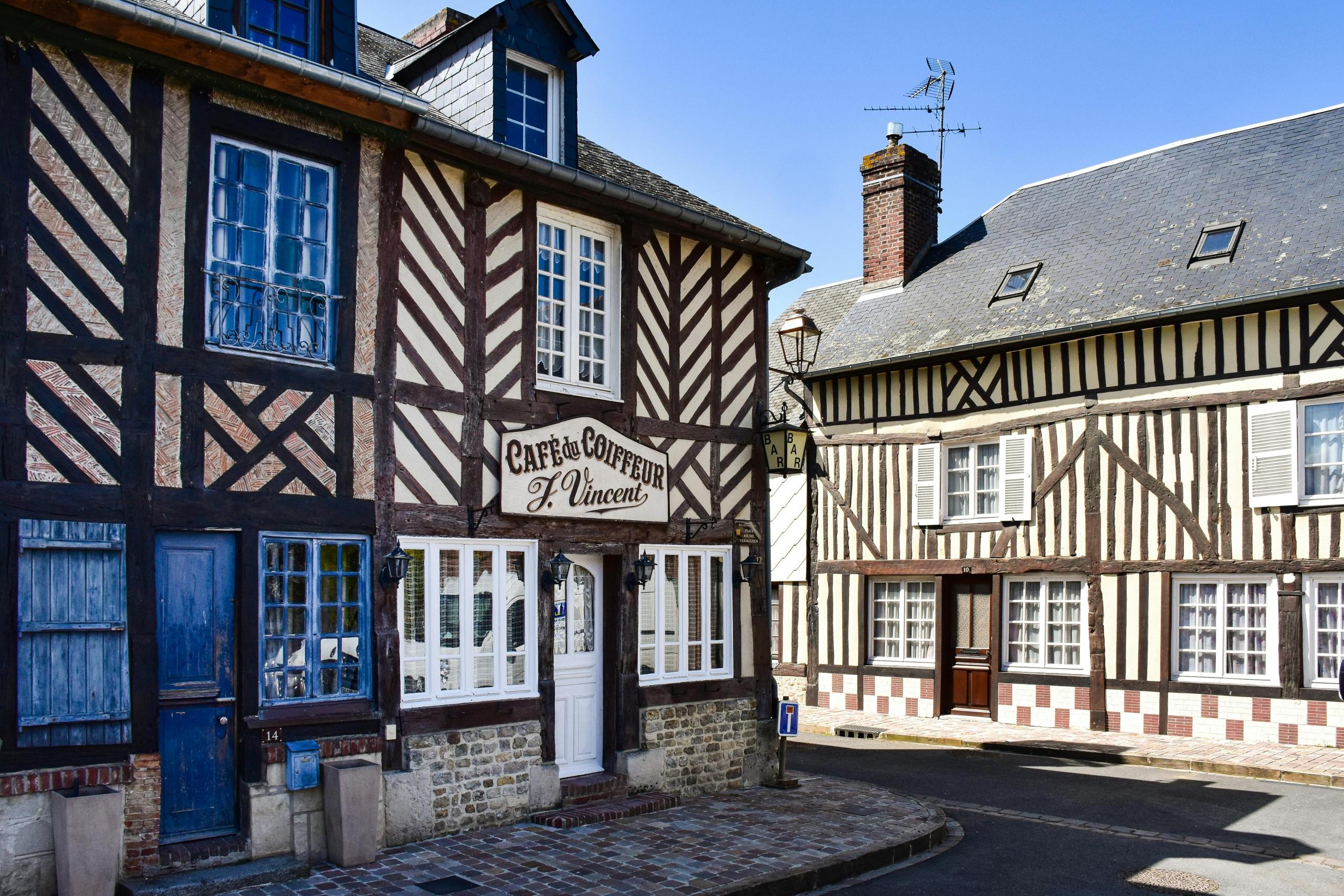 a series of tudor buildings in a village