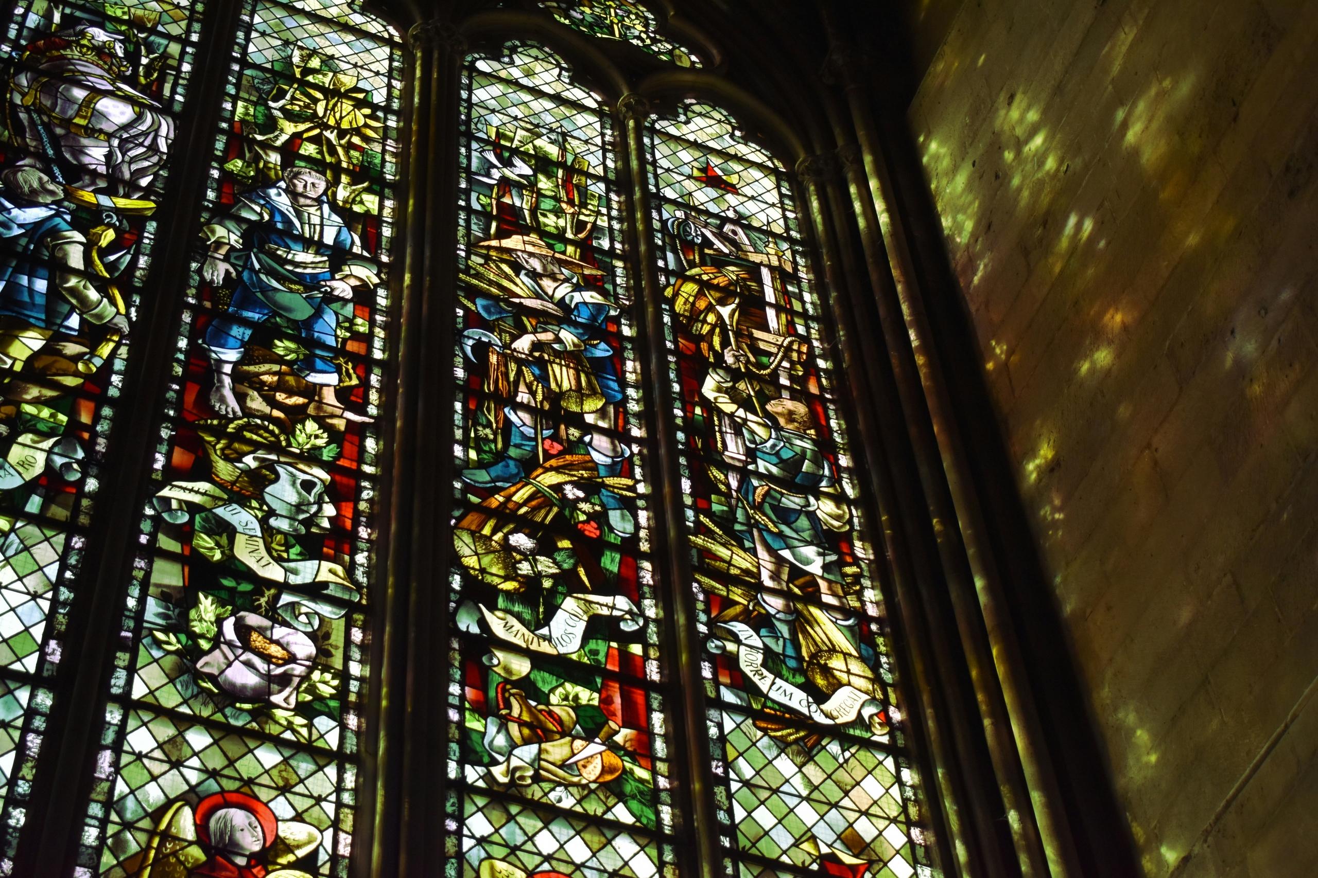 a large stained glass window in a church