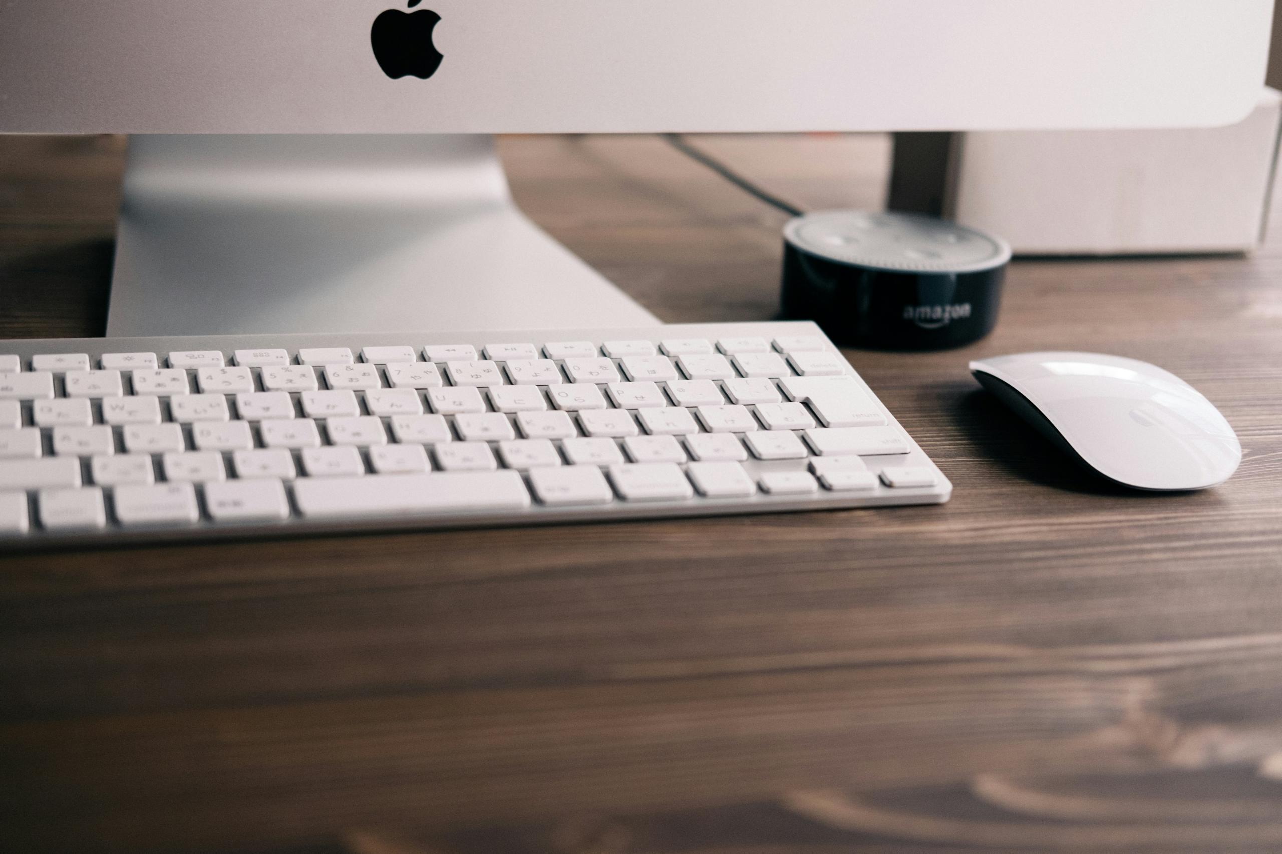 close up of white mac computer, keyboard and mouse