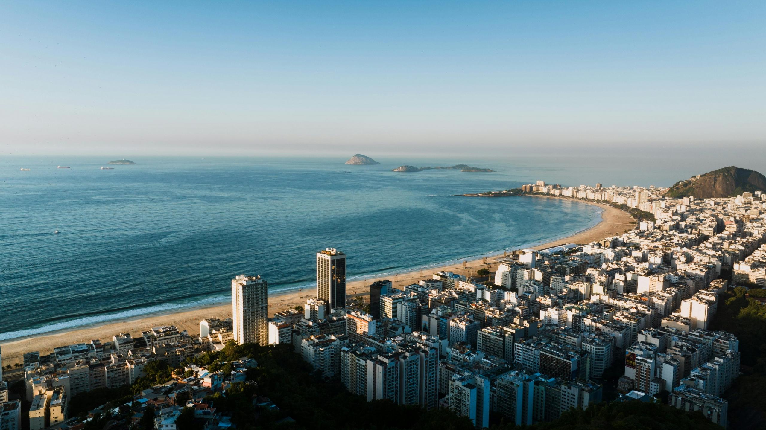 landscape image of a beach and buildings in brazil early in the morning
