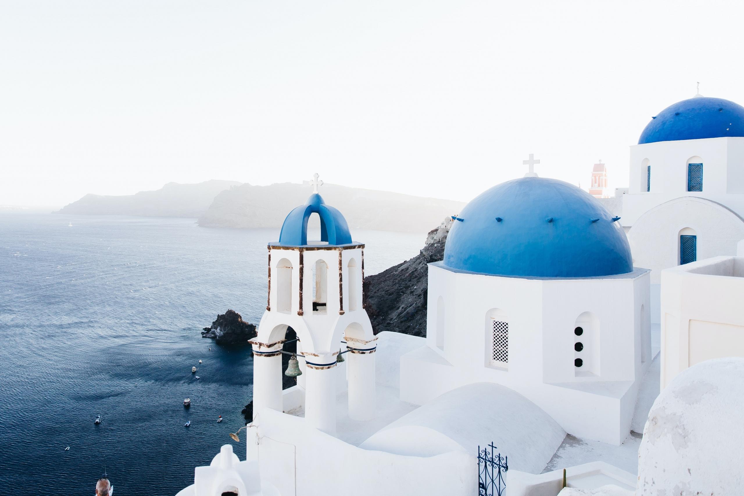 Greek church on island painted in traditional colours of white and blue