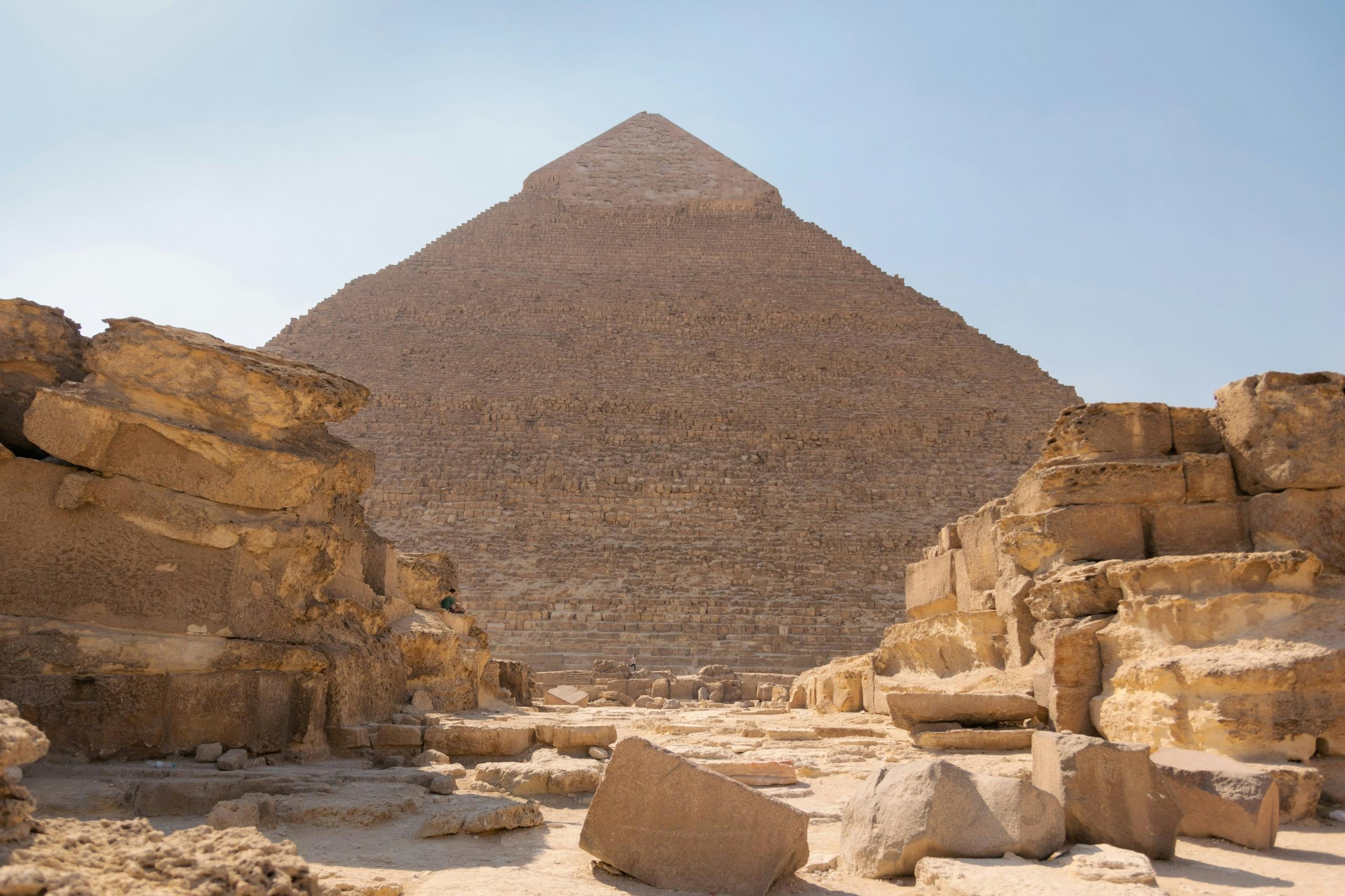 ancient Pyramid in Egypt, with crumbling ruins in the foreground