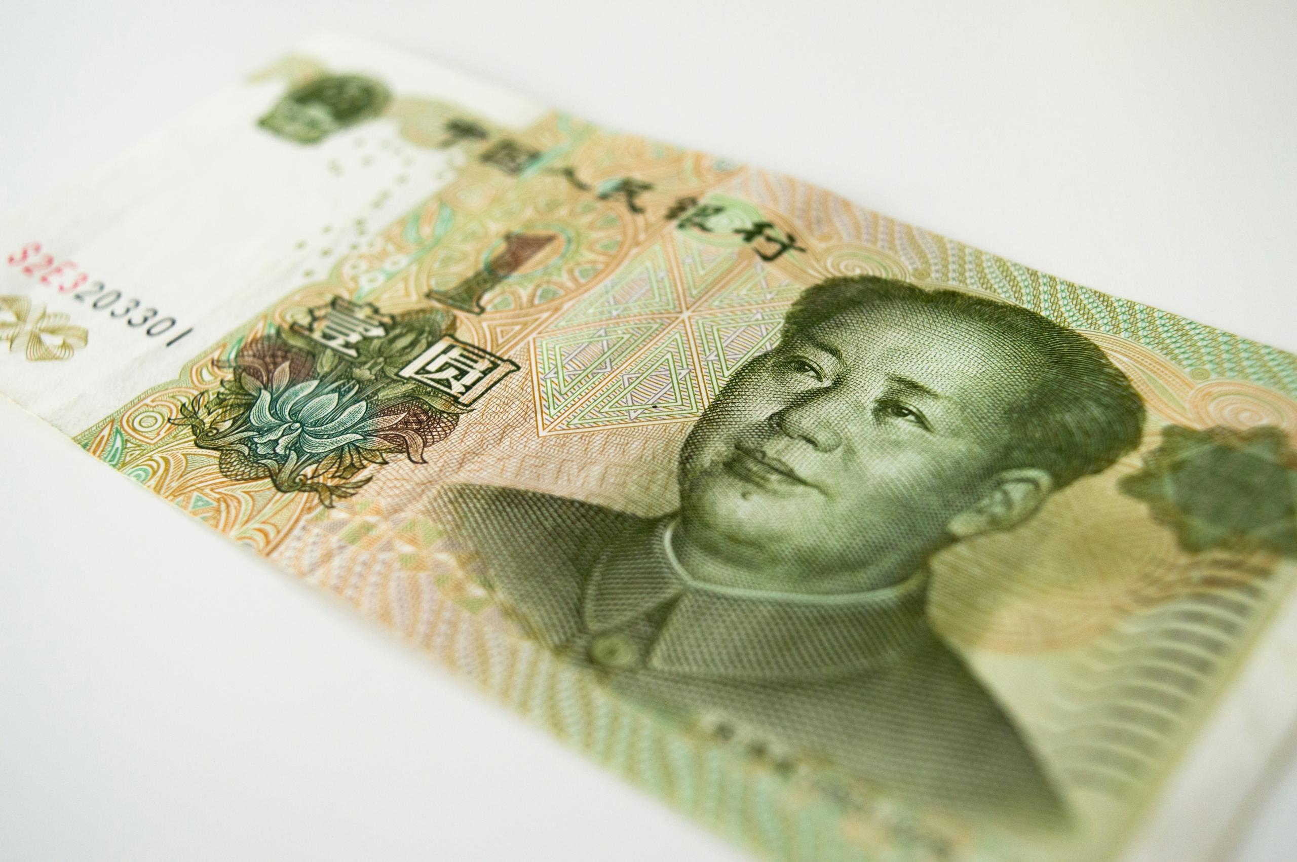 green yuan banknote on white background
