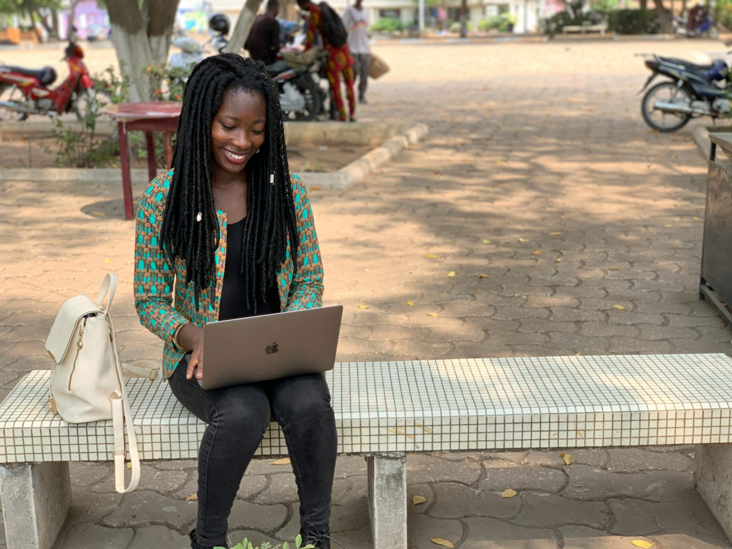 A young woman engaging with someone online. 