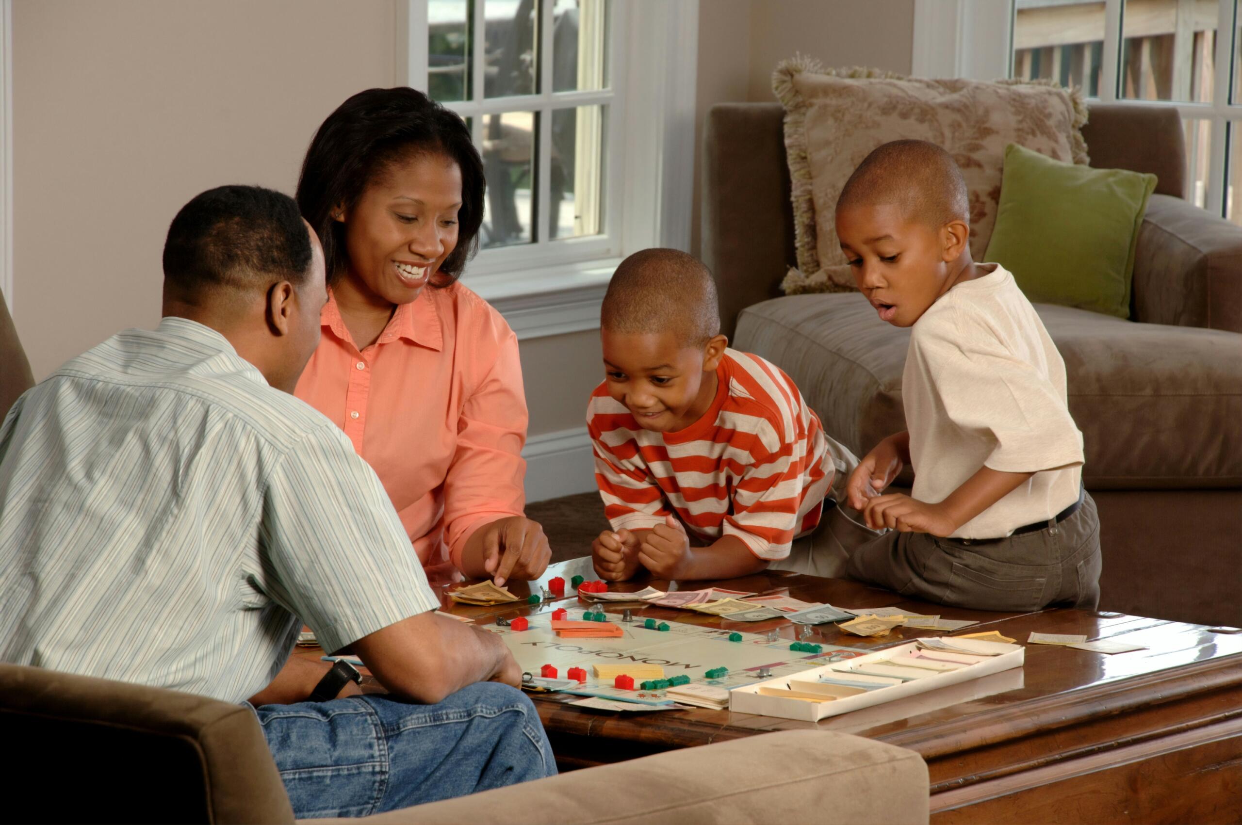 A family playing a board game. 