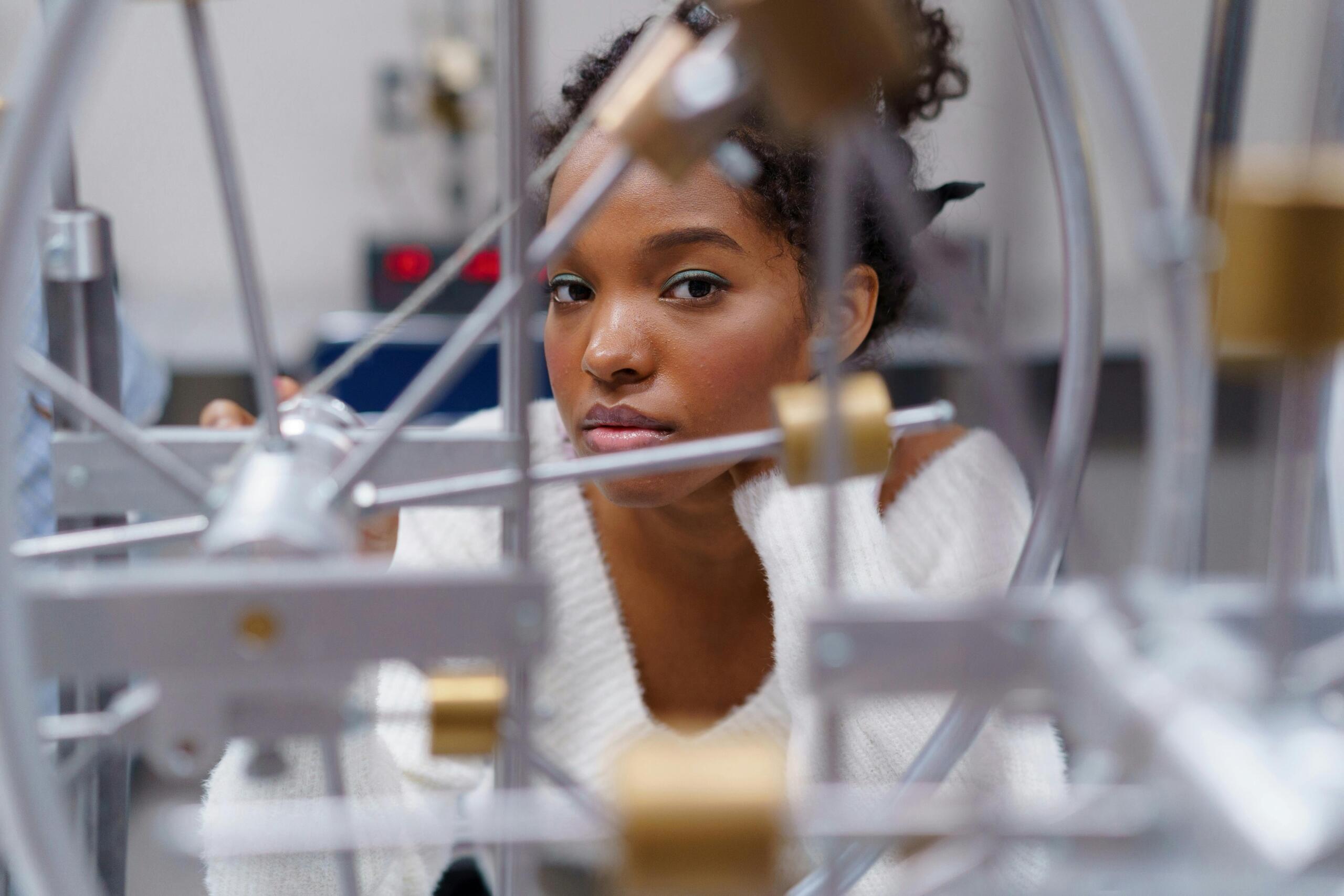 A senior student looks through her engineering project.