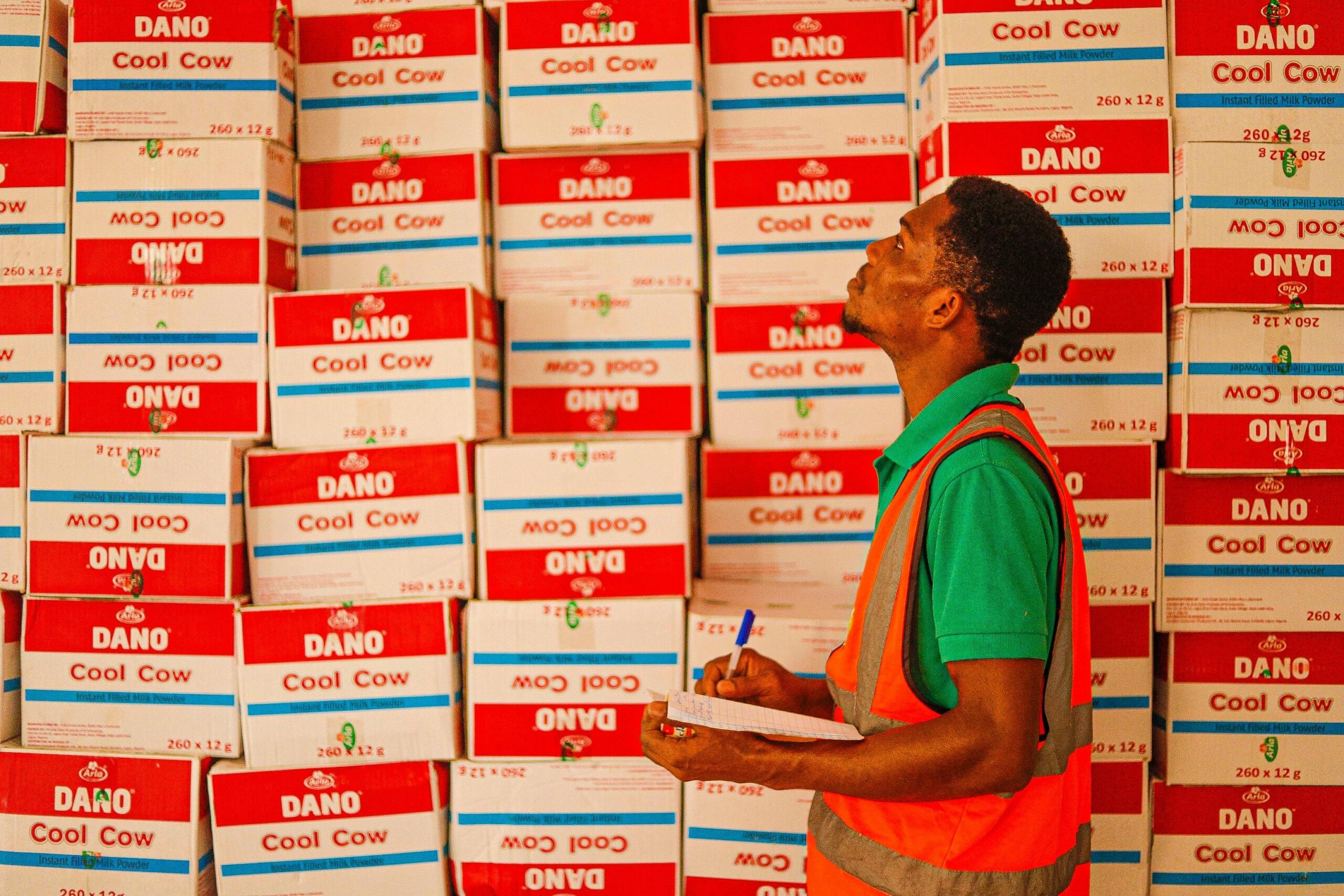 A worker conducts a stock take. 