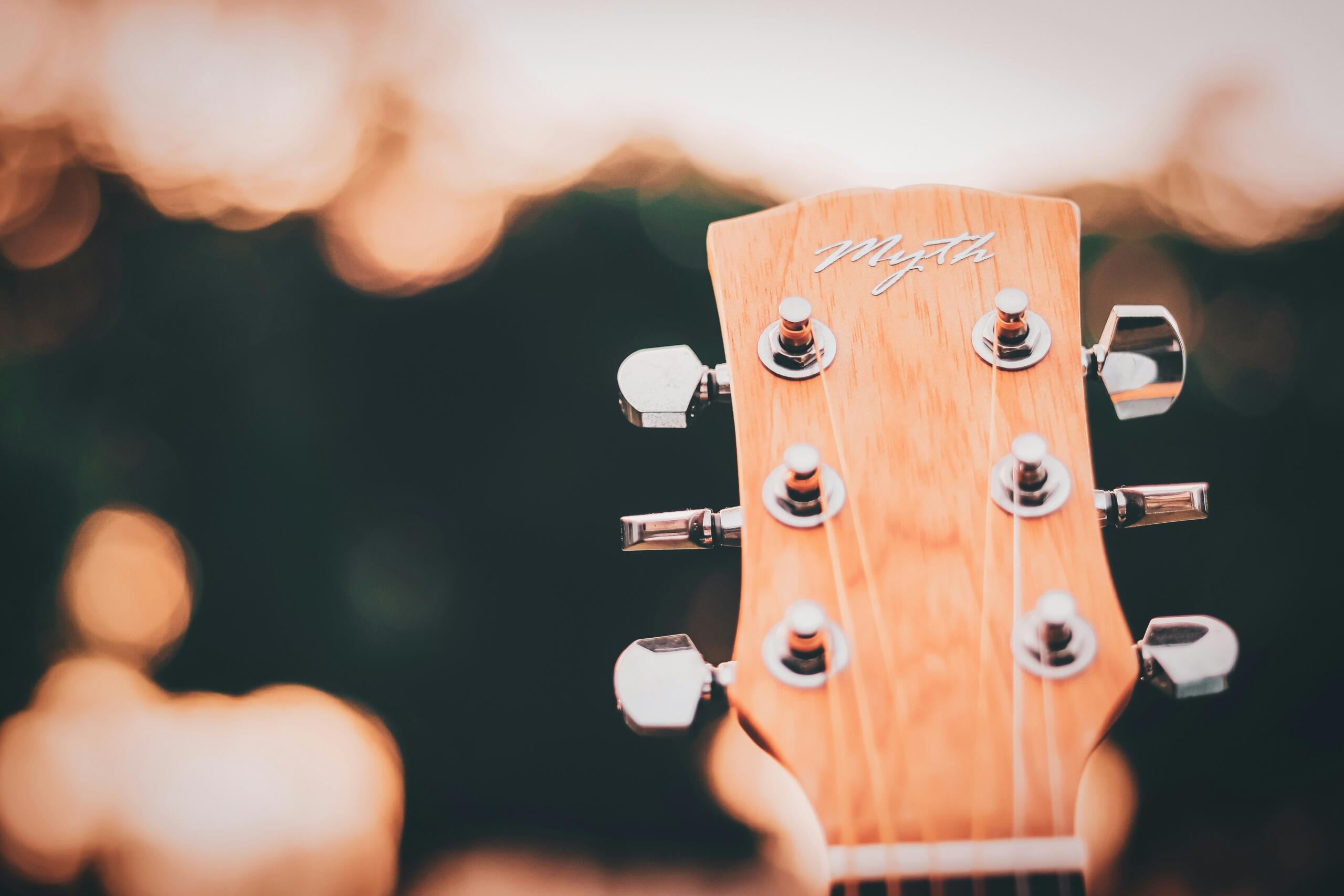 close up of guitar handle under sparkling lights