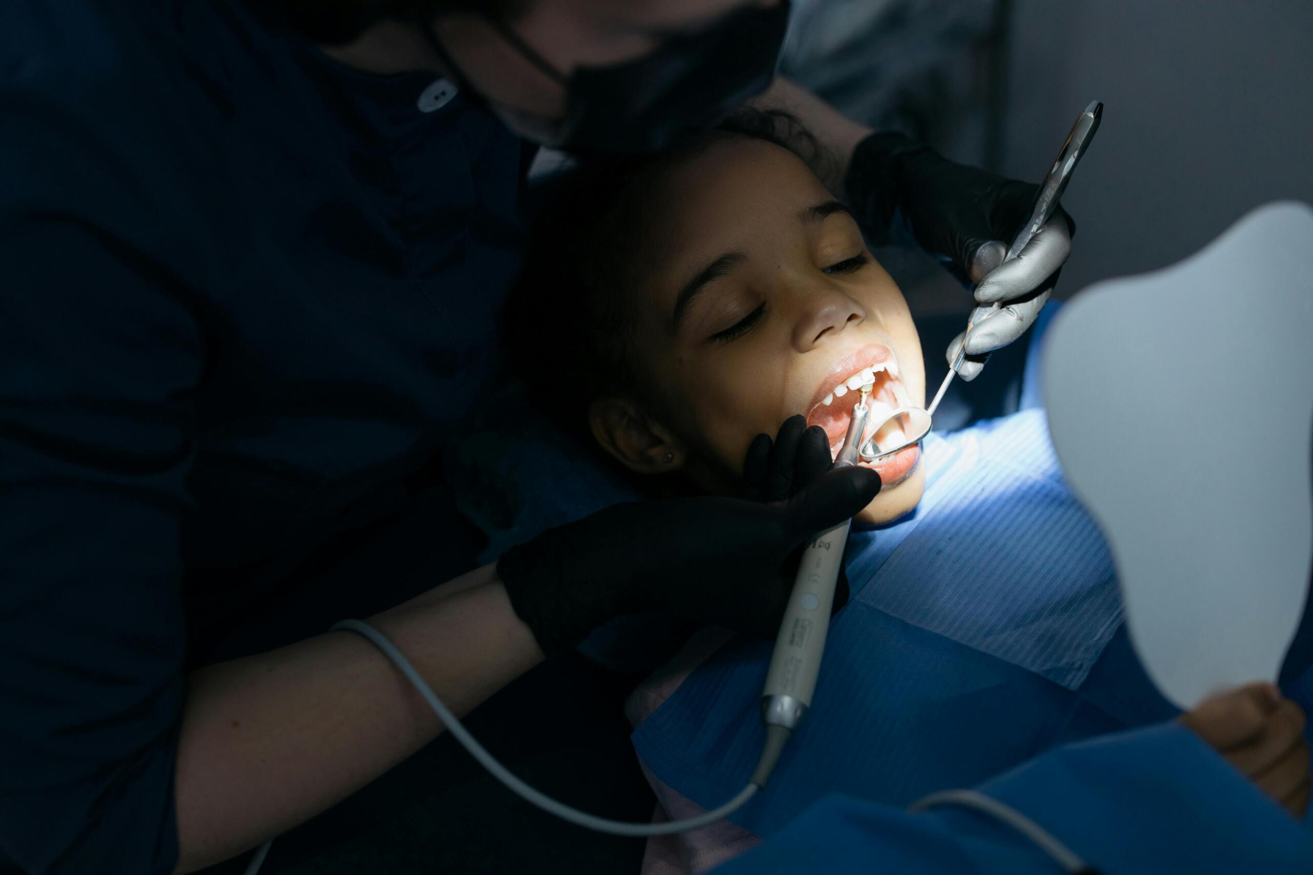A child in a dentist's chair.