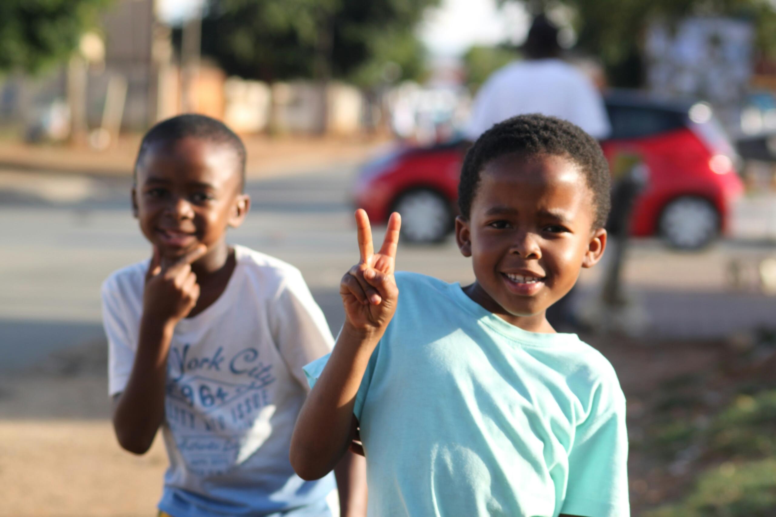Happy children in South Africa standing for peace.