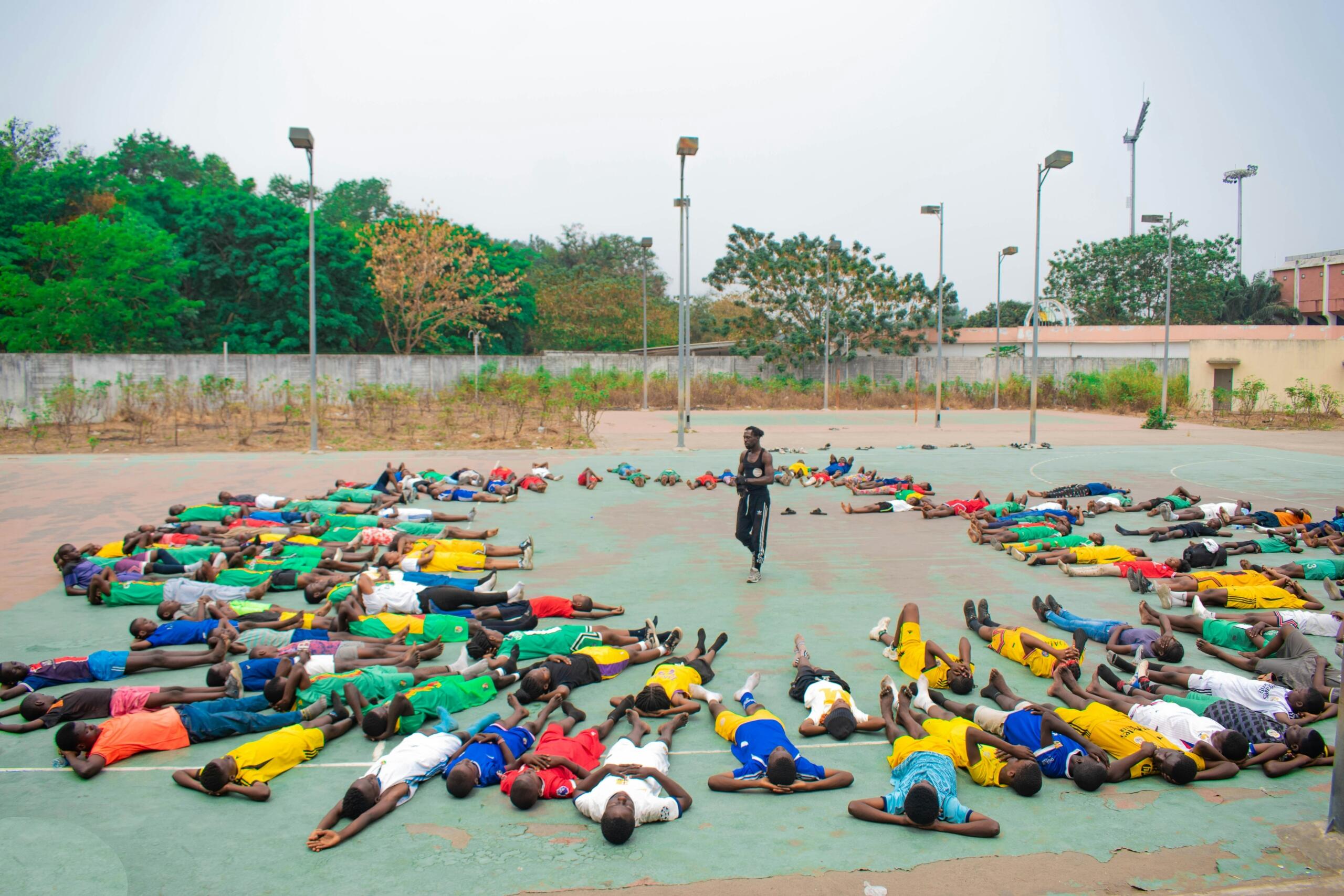 Learners lie in a circle.