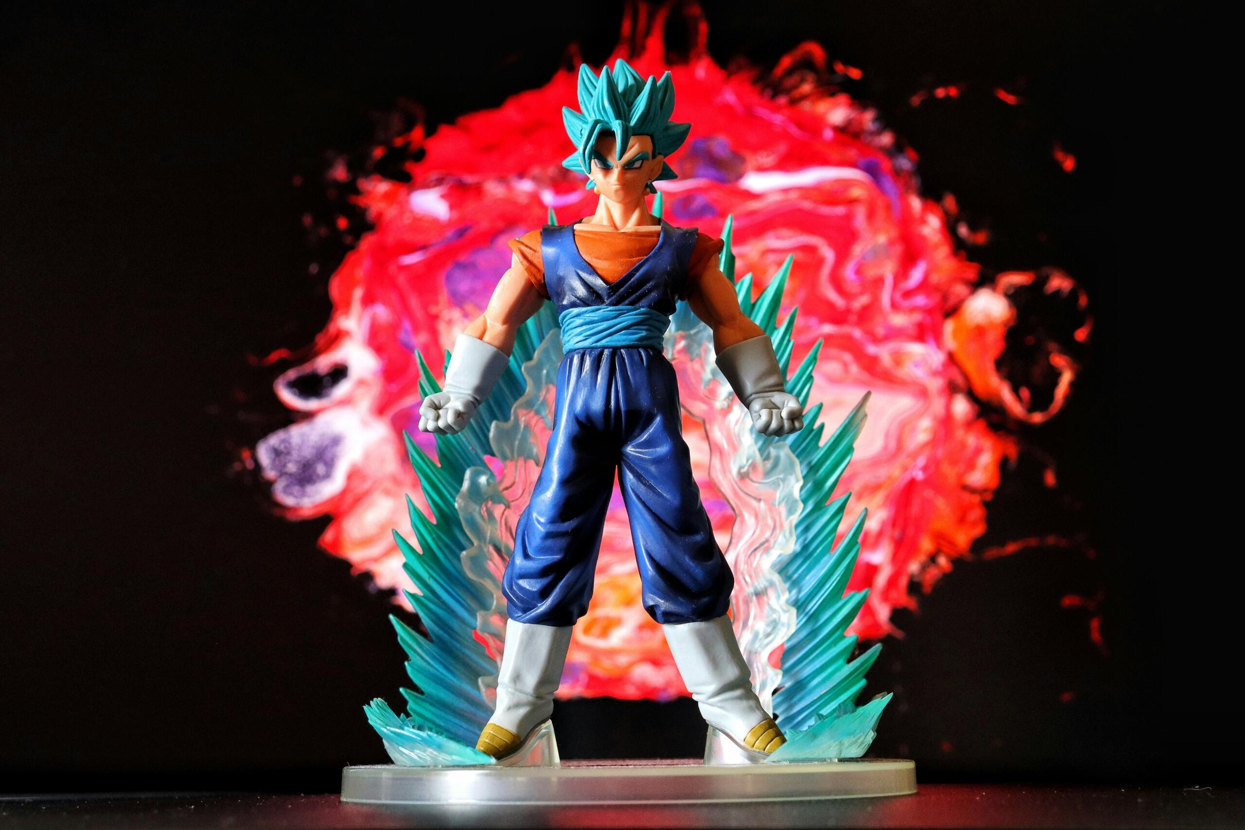 action-figure-of-dragon-ball-z-anime-character-with-blue-aura-and-fiery-background
