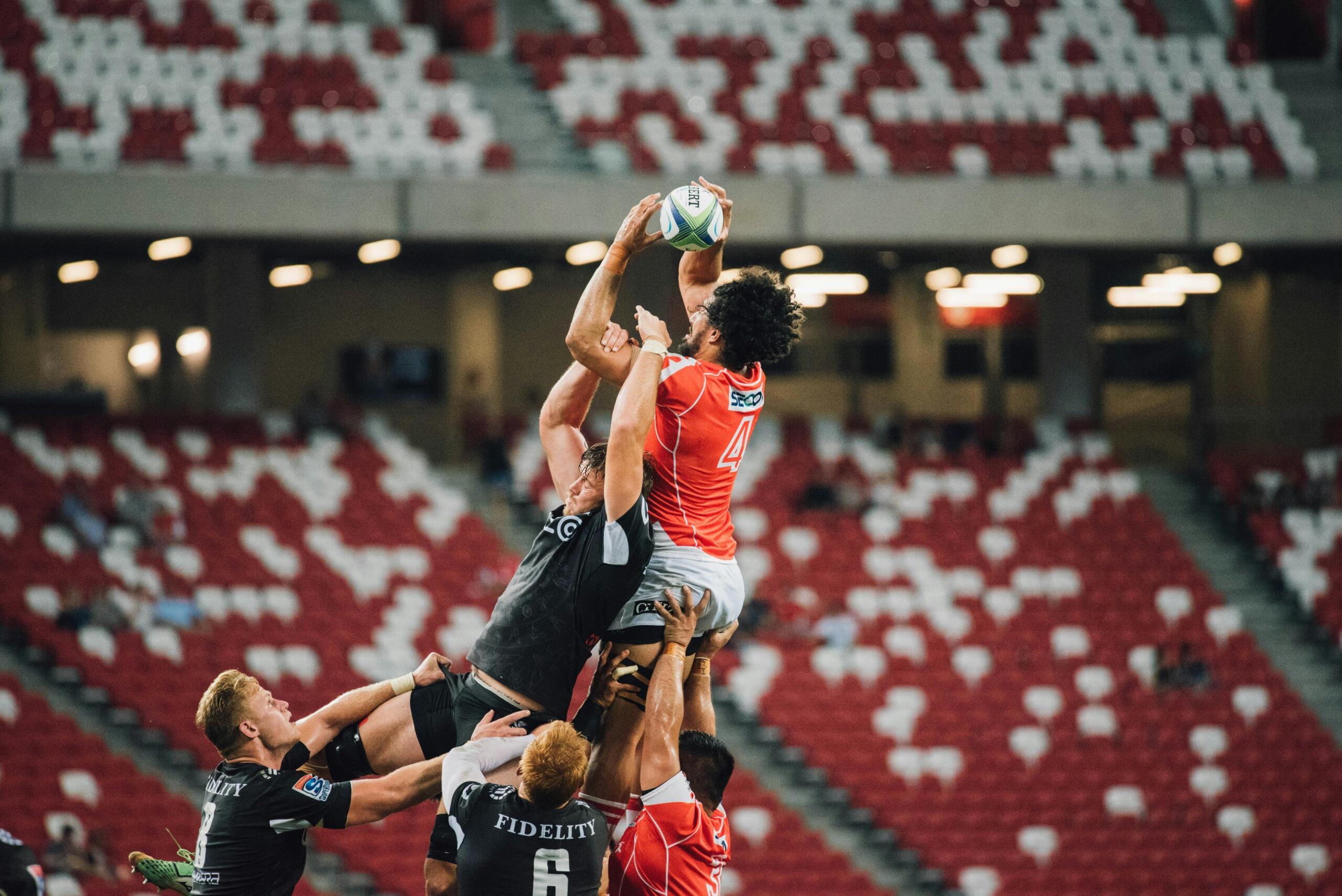 An image of rugby players jumping in a line out. 