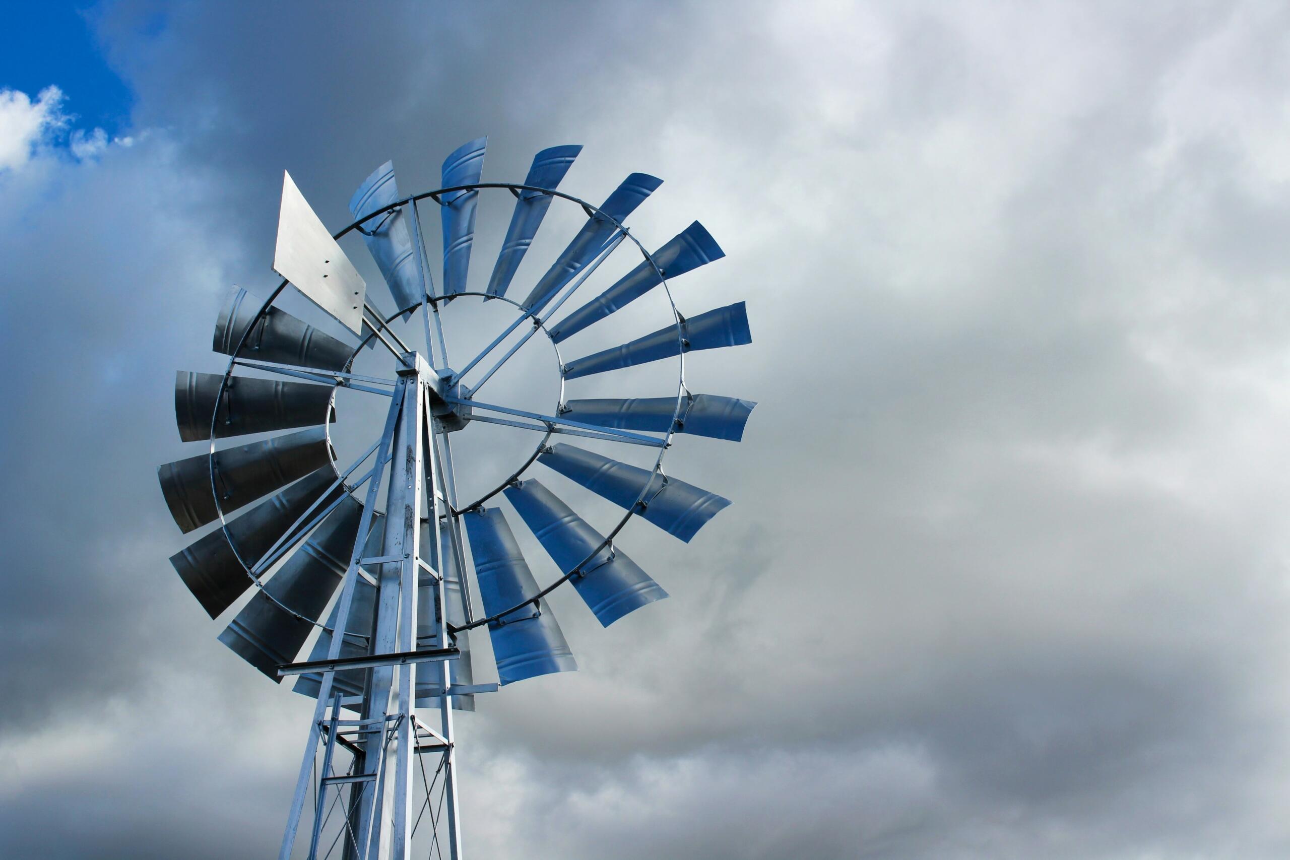 An image of a windmill against a stormy sky. 