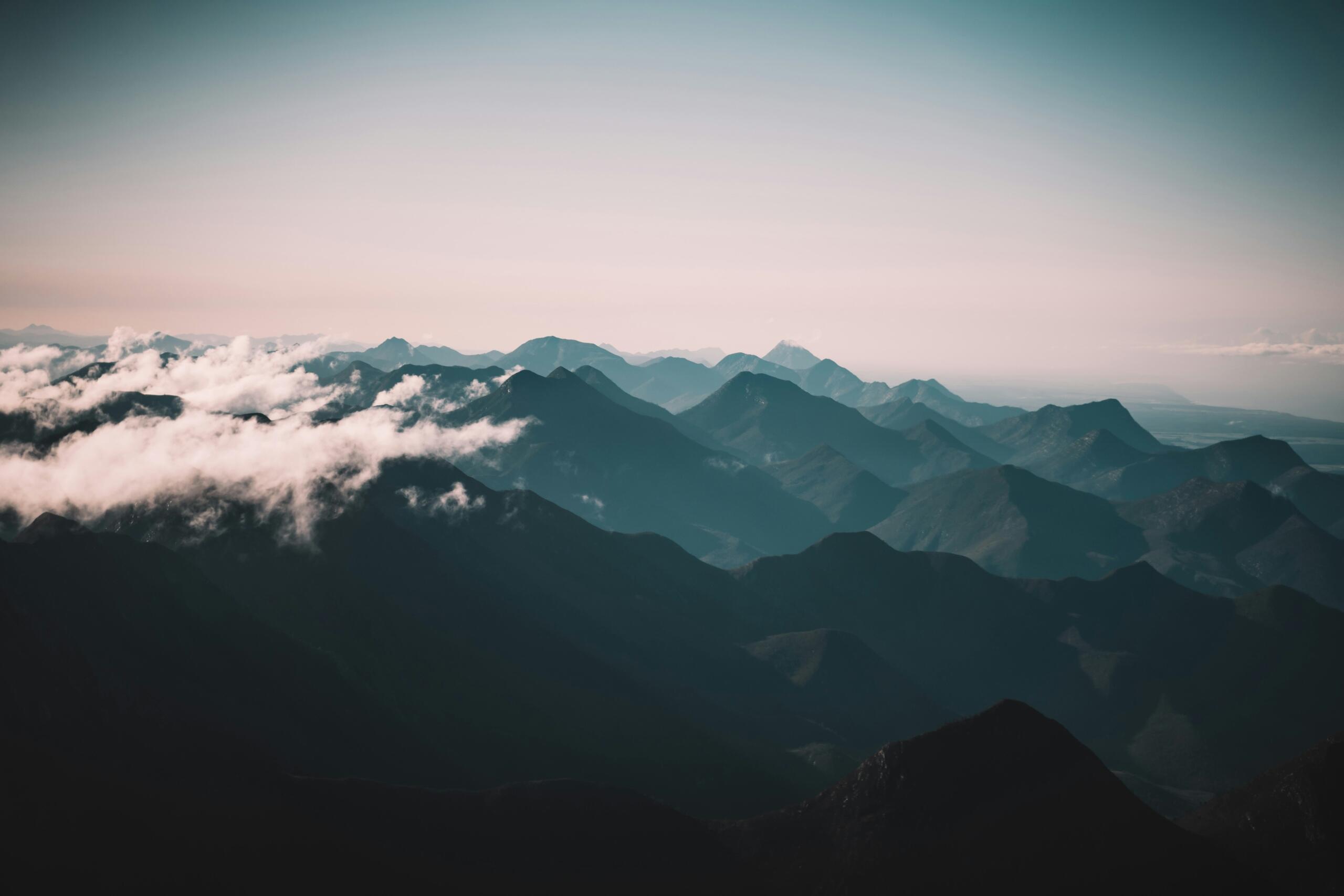 An image of mountains under cloud.