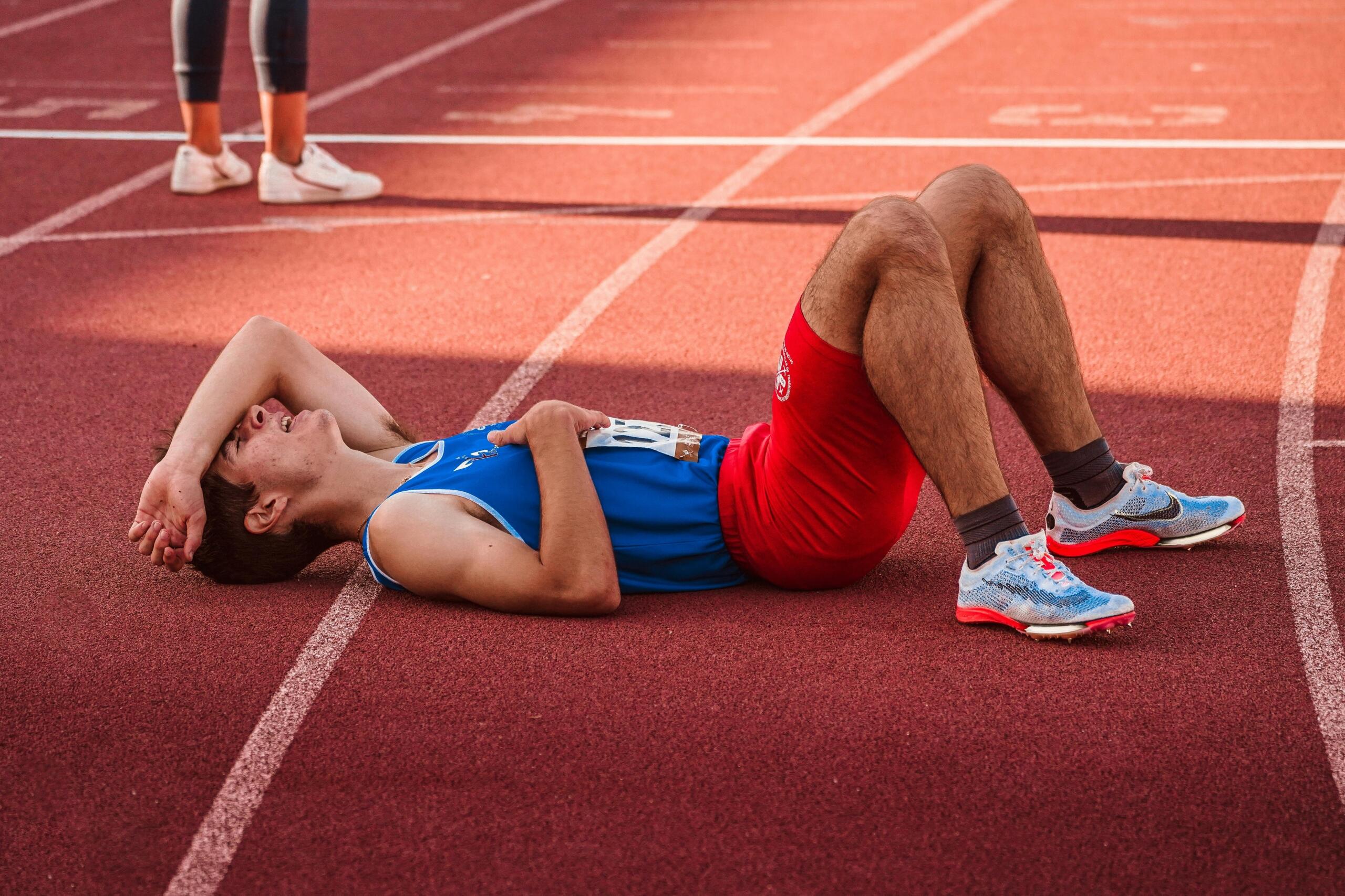 An image of an exhausted runner after a race. 