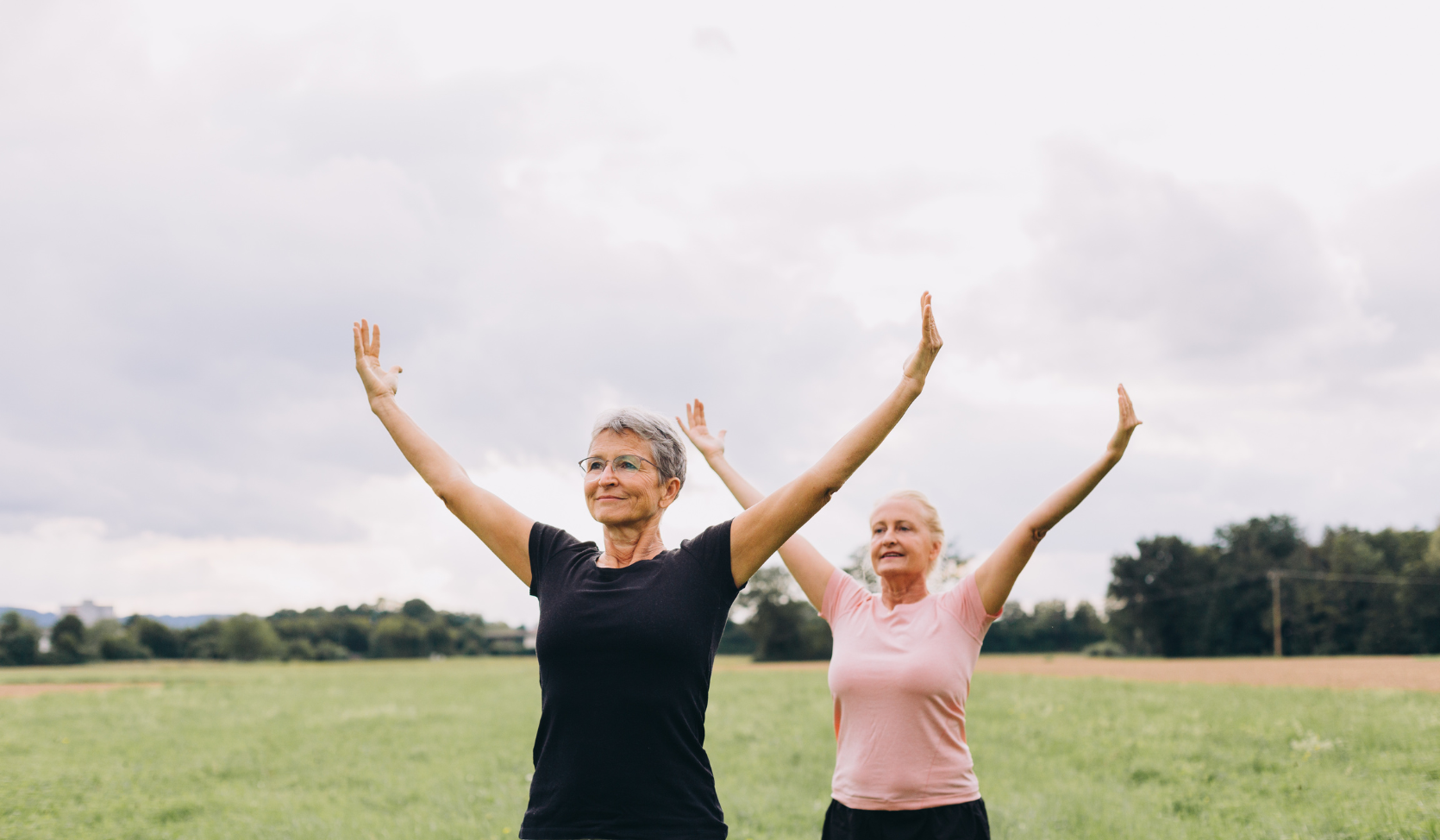 An image of two woman doing Tai Chi exercises.