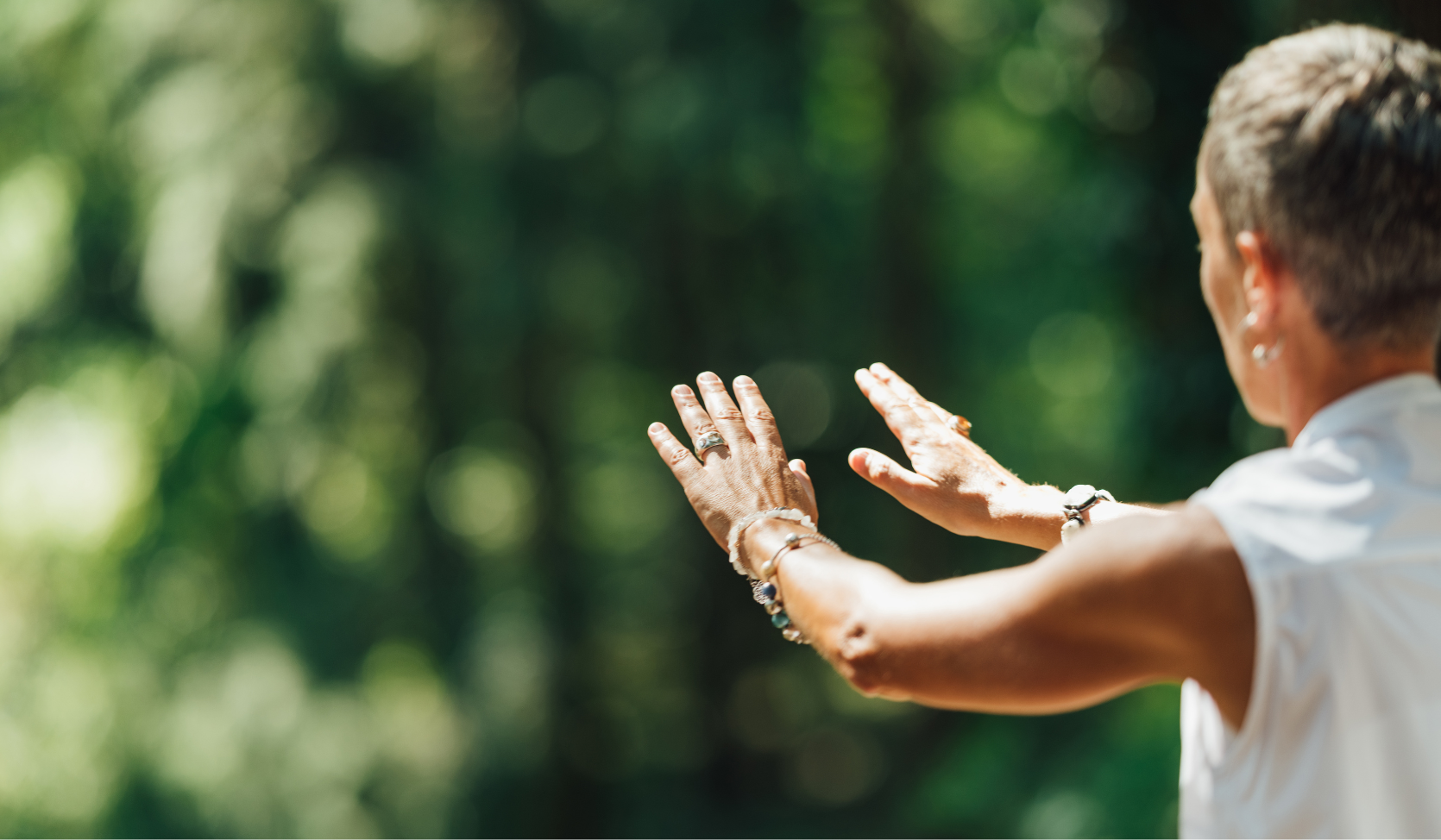 An image of a  woman's hands in a Tai Chi movement.