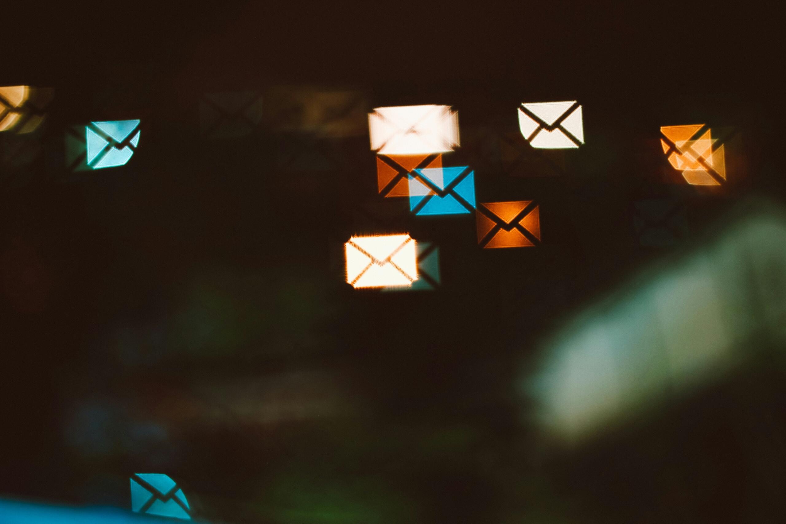 An image of email icons floating in a digtial background.