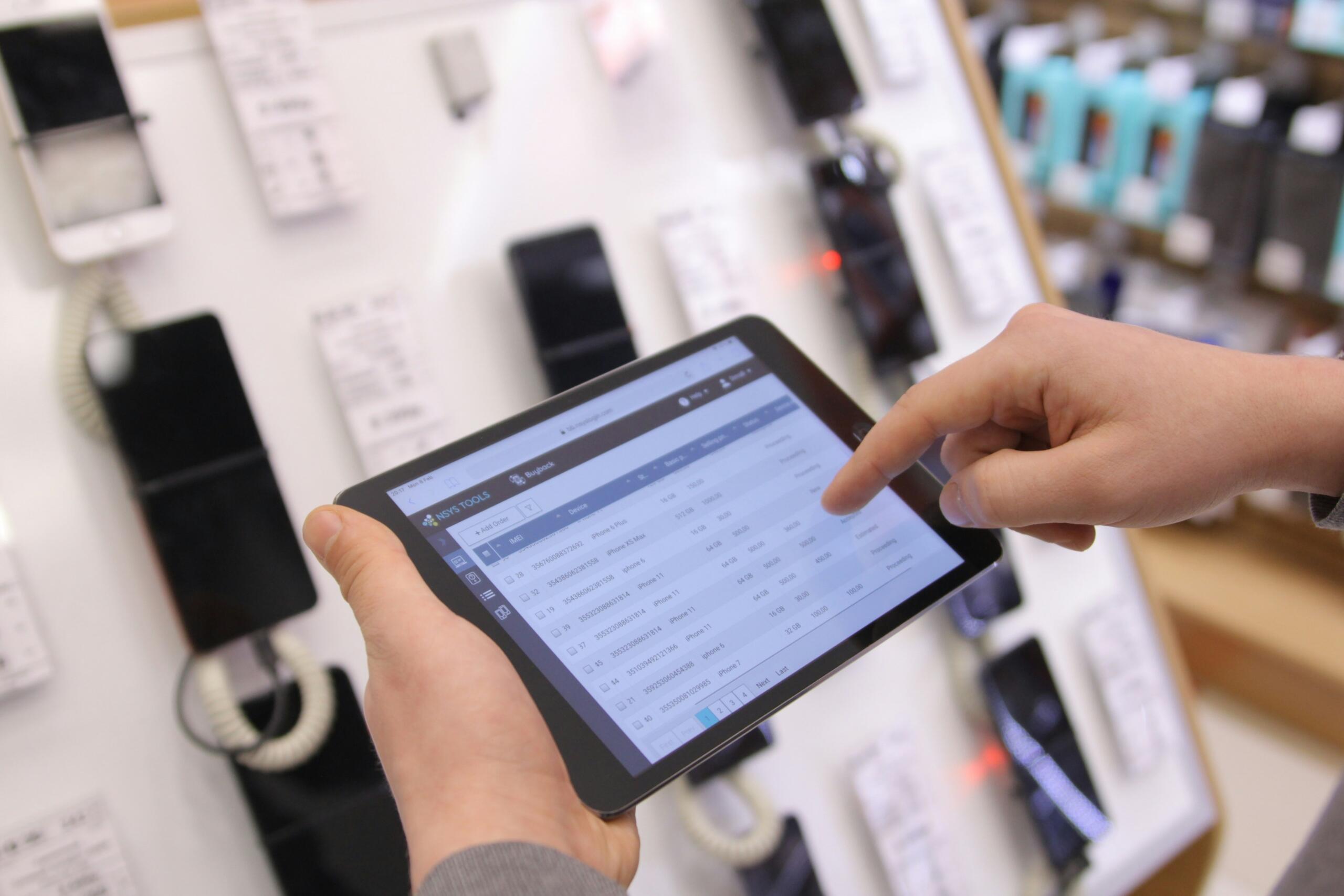 An image of a digital device being used in a transaction. 