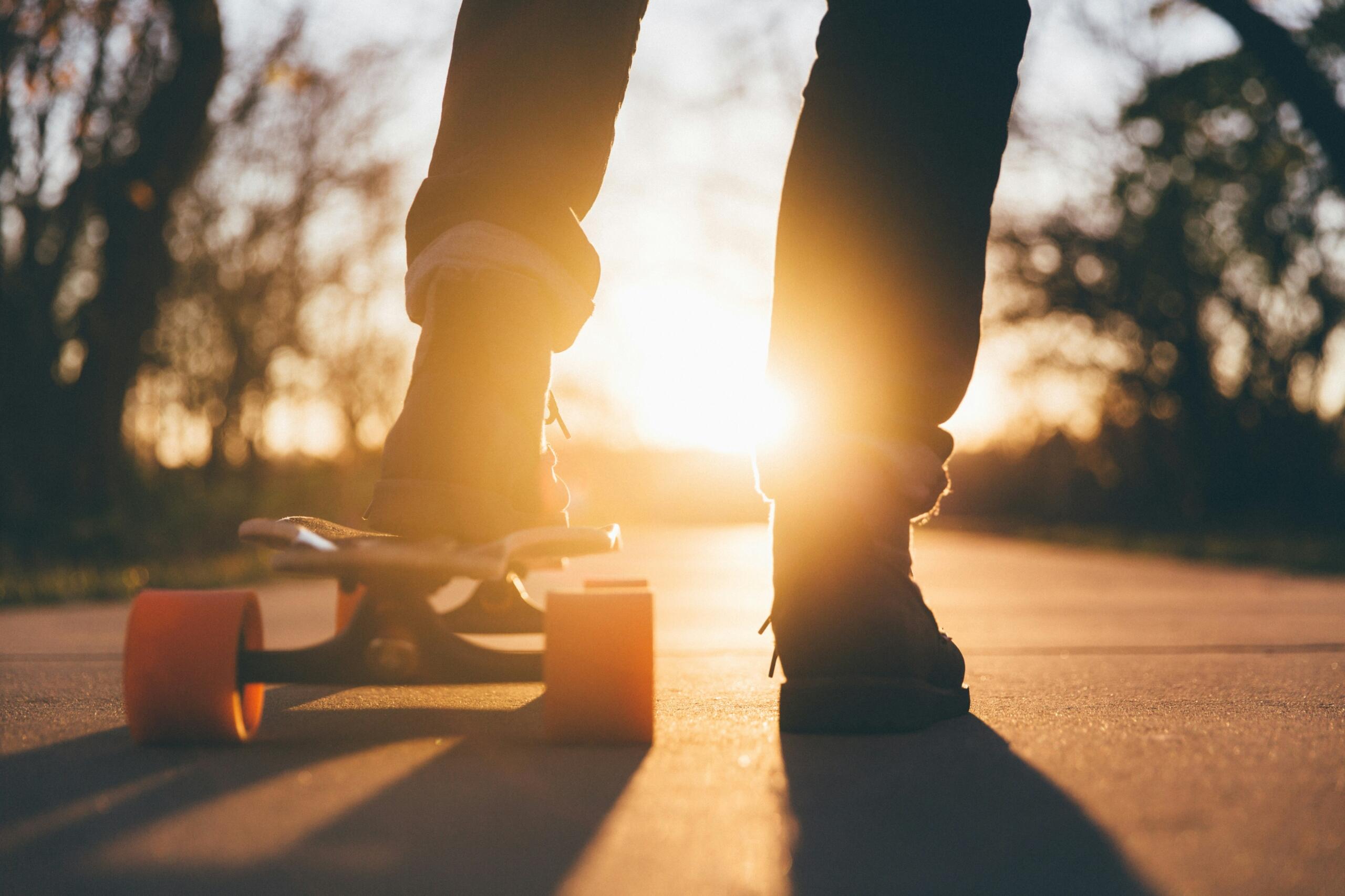 person skateboarding at sunset