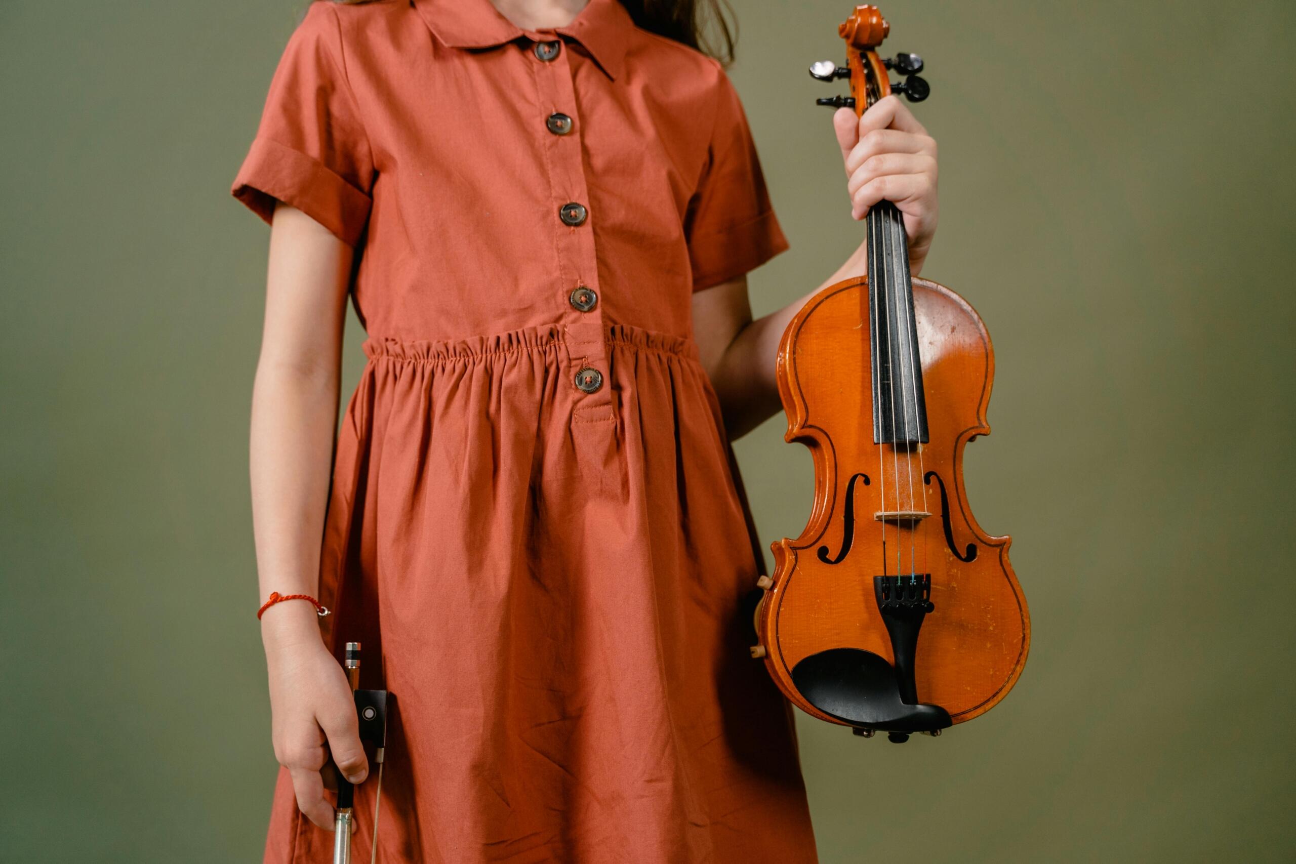 girl holding a violin