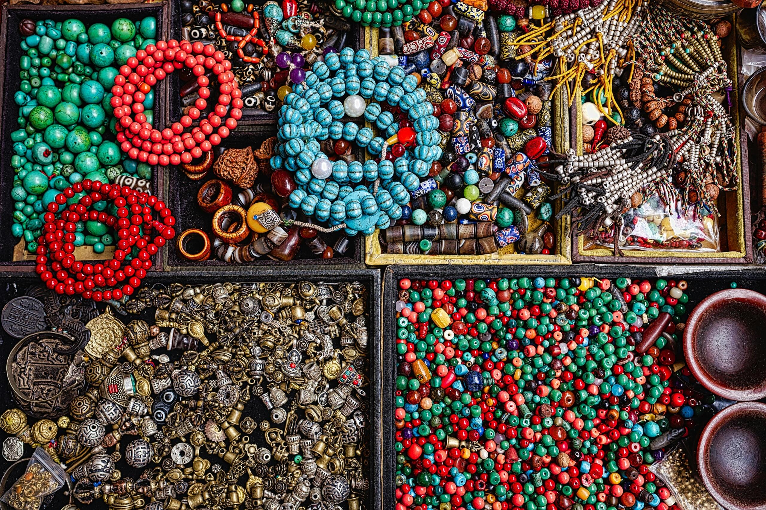 An image of a bead box with multi-coloured Zulu beads in sections.