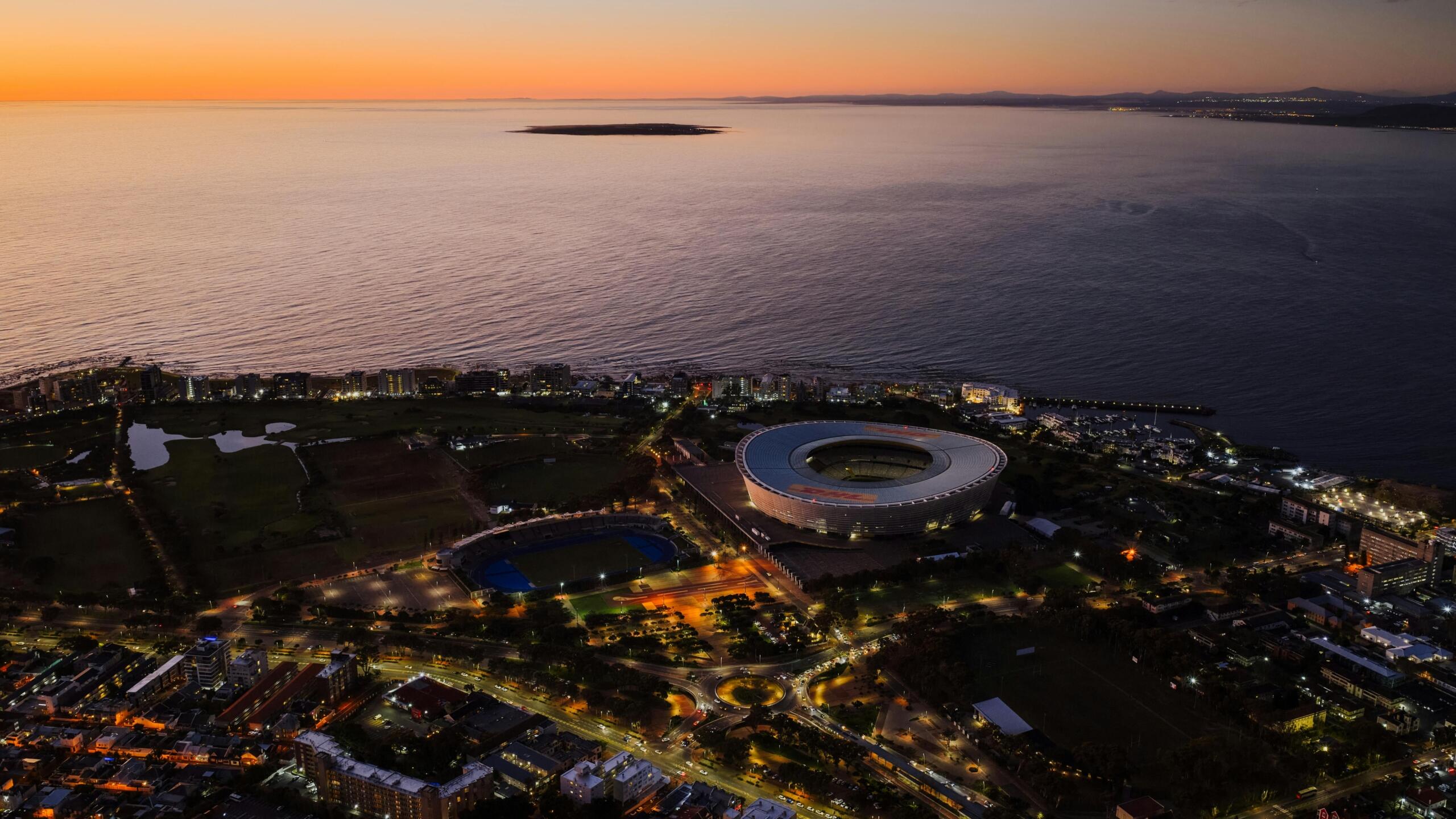 An aerial view of Cape Town Stadium at sunset.