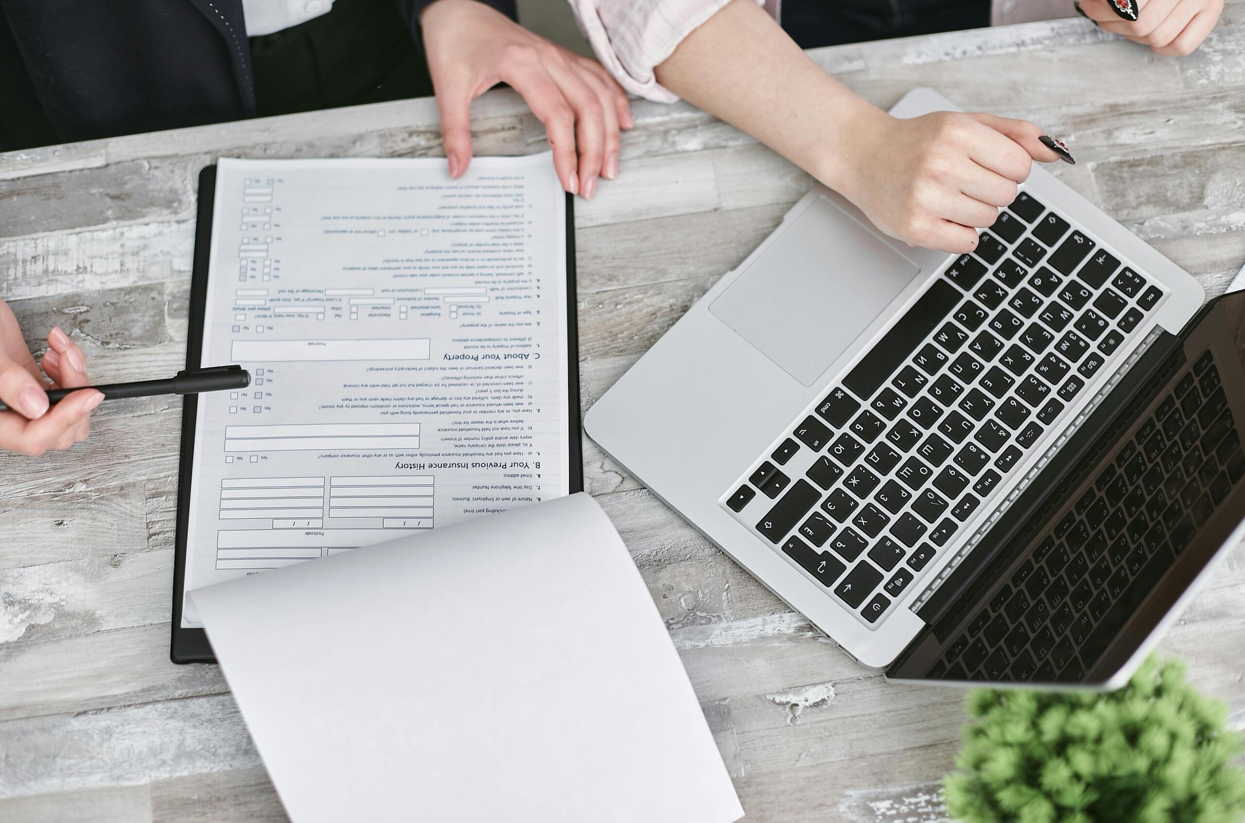 documents-and-a-laptop-on-a-table
