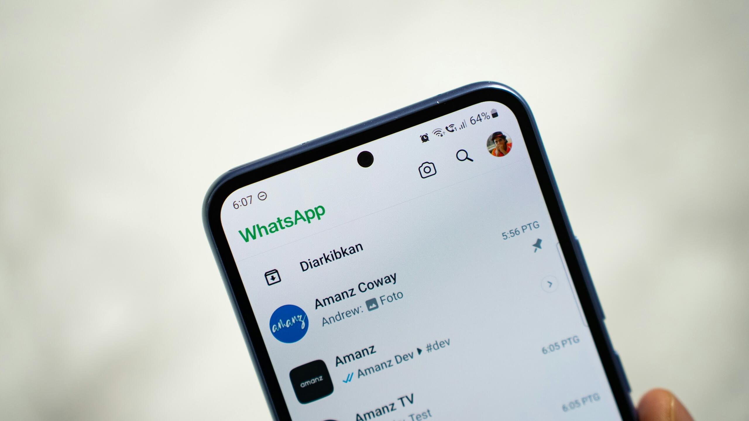 A cellphone with WhatsApp open on the phone
