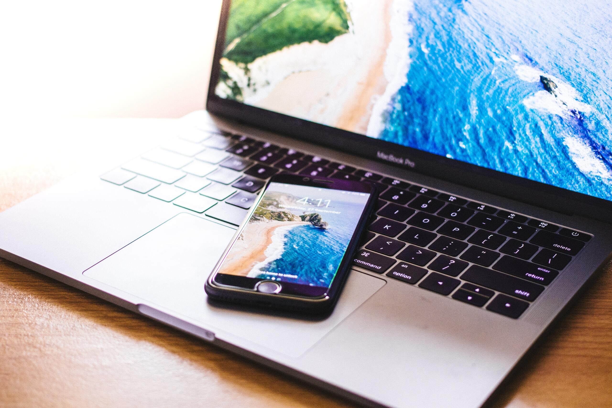 smarthphone placed on laptop keyboard