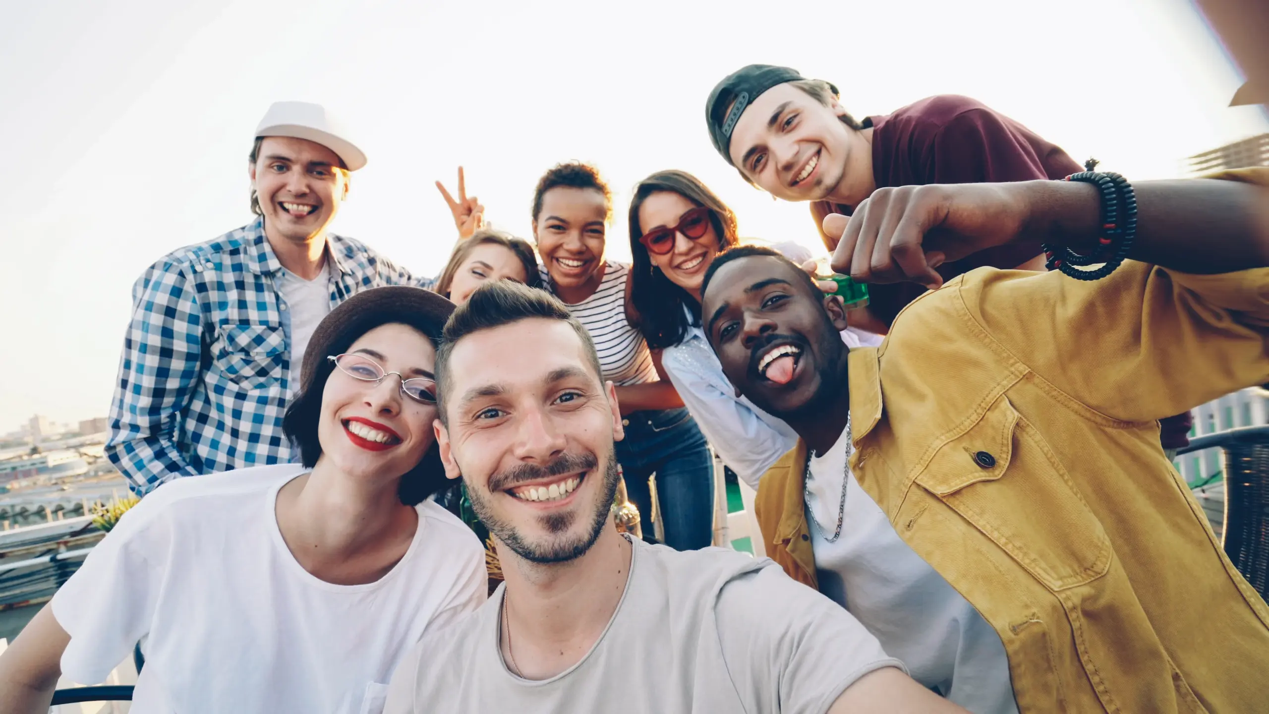 happy-group-of-friends-taking-a-selfie-outdoors