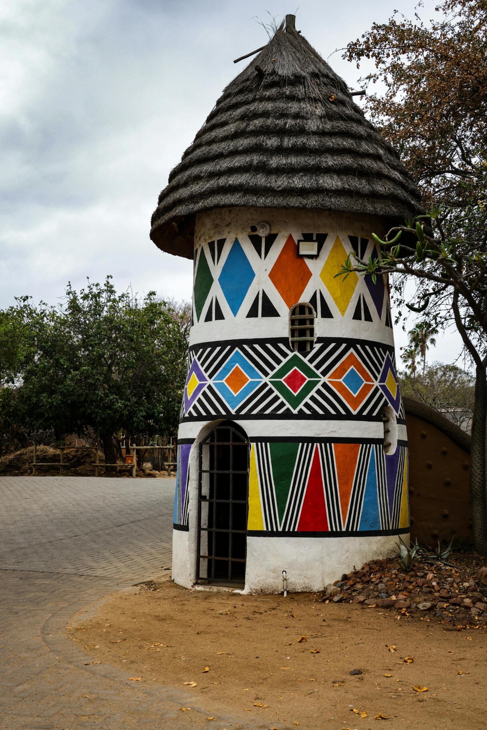 An image of an Ndebele designed building, showing colourful patterns.