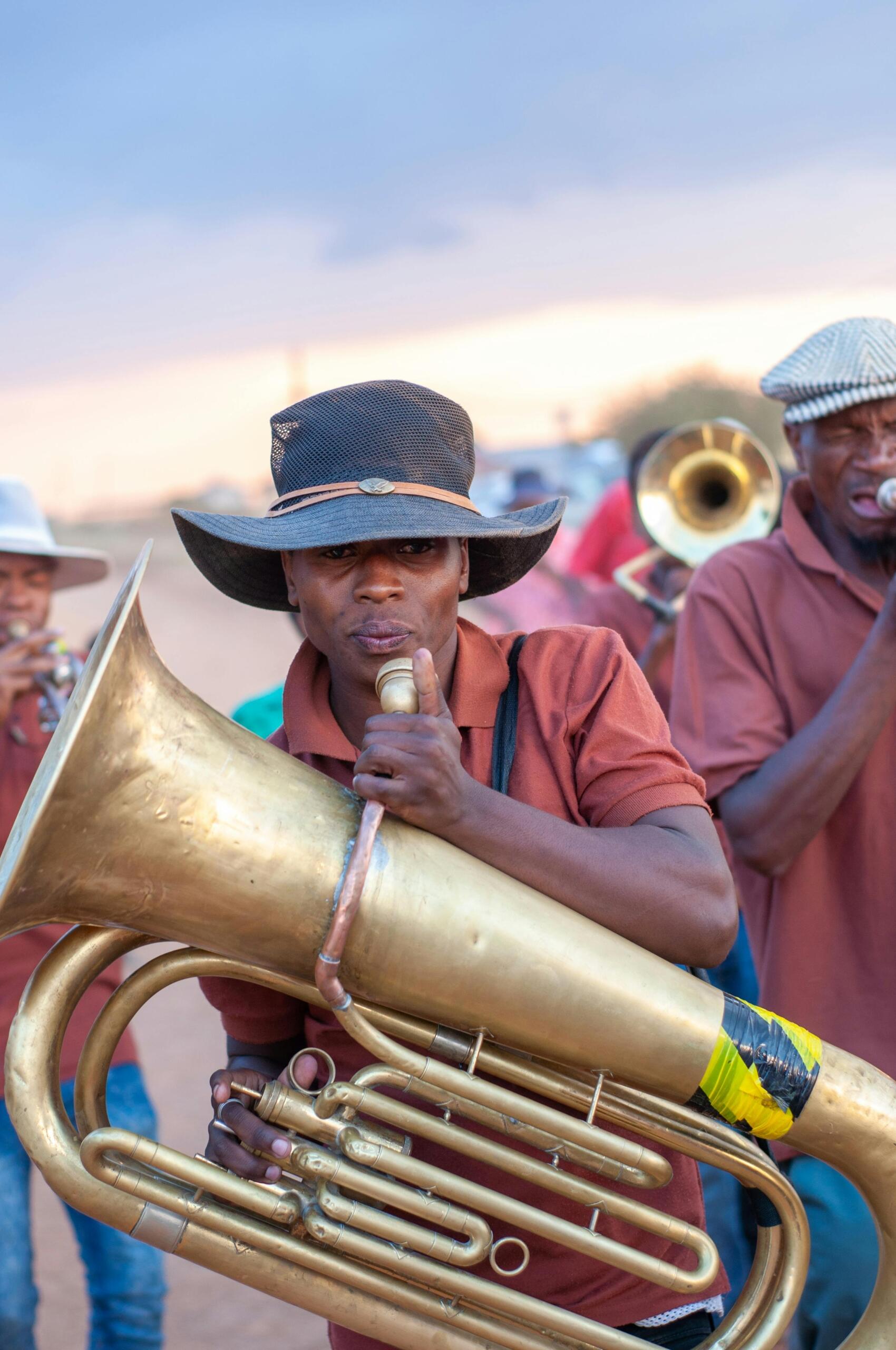 An image of a musician with a brass instrument.