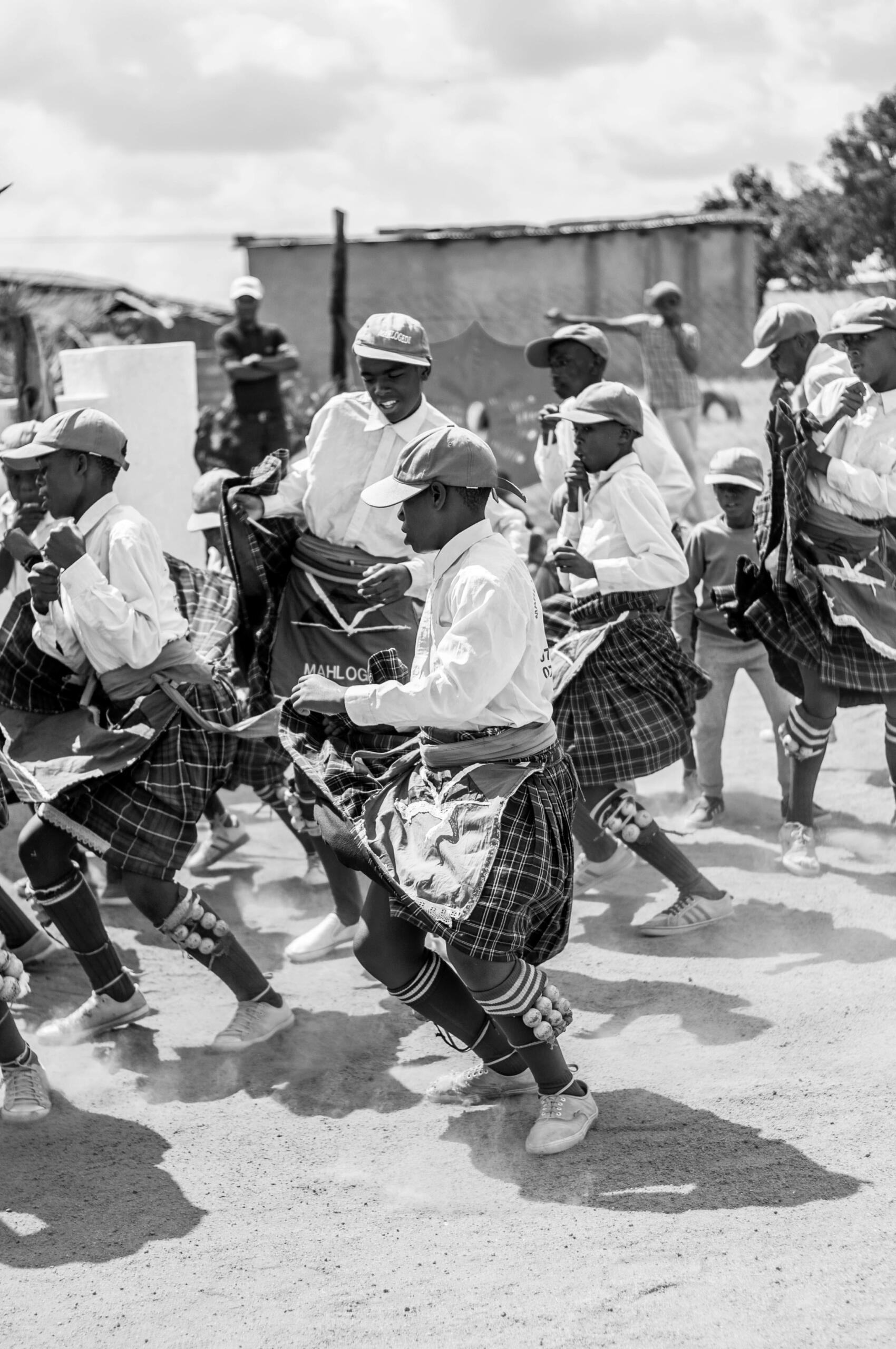 A black and white image of traditional dancers.