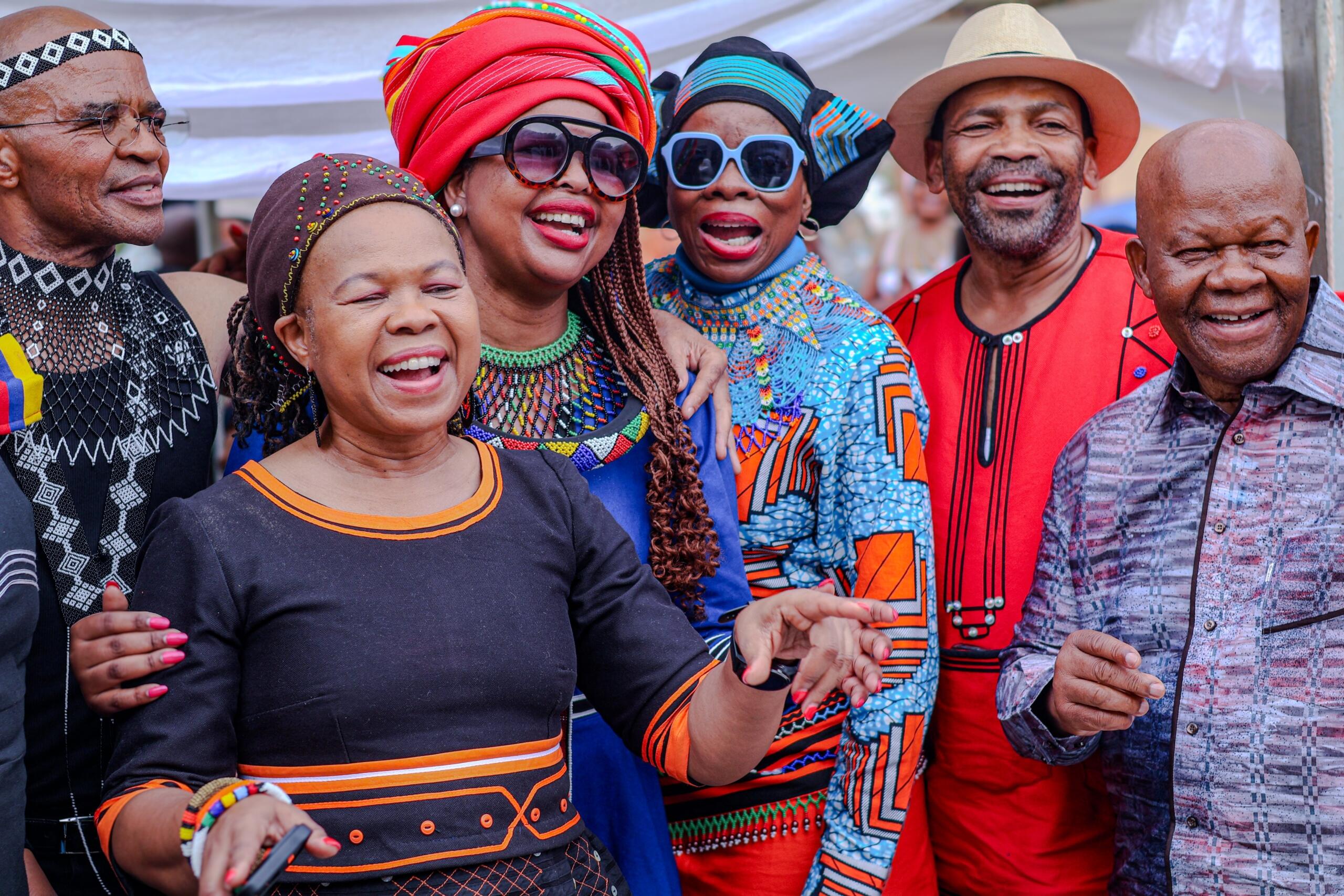 A group of people in traditional dress celebrate
