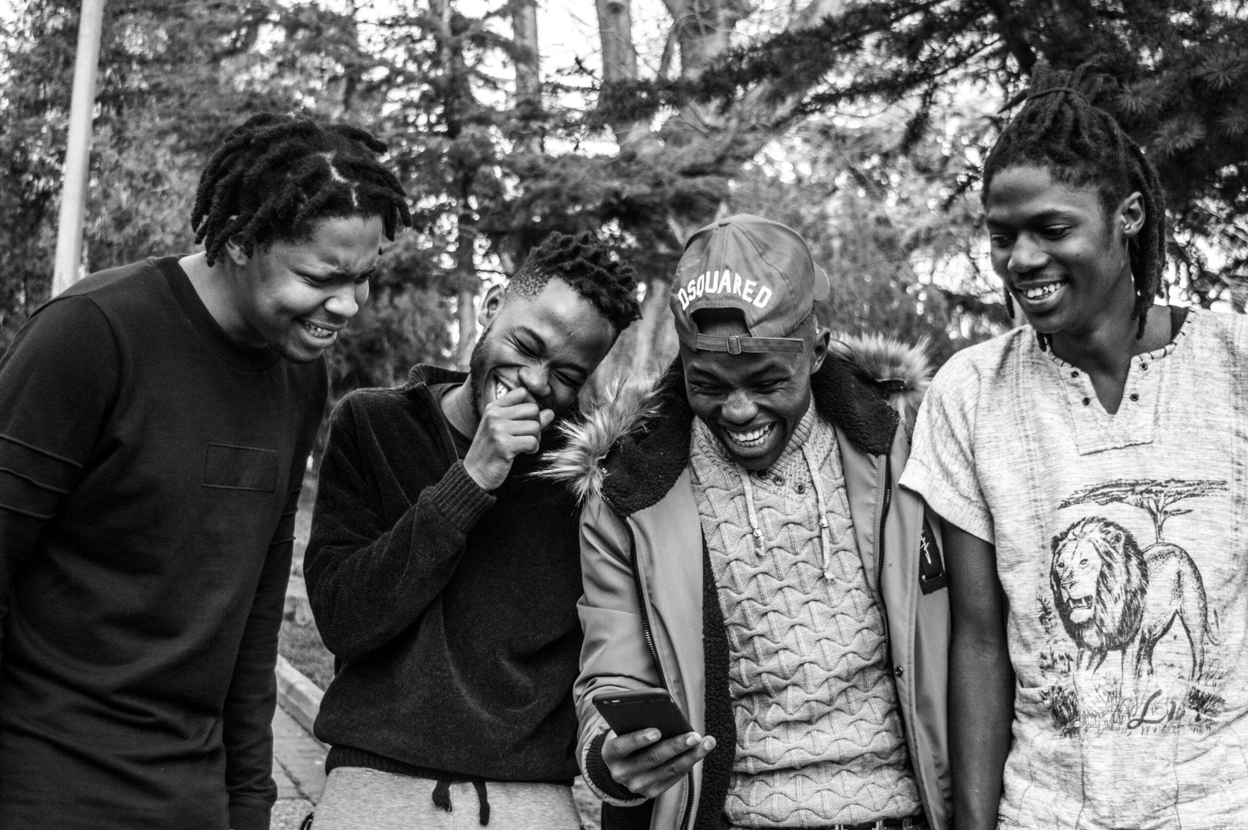 A black and white image of young people engaging.