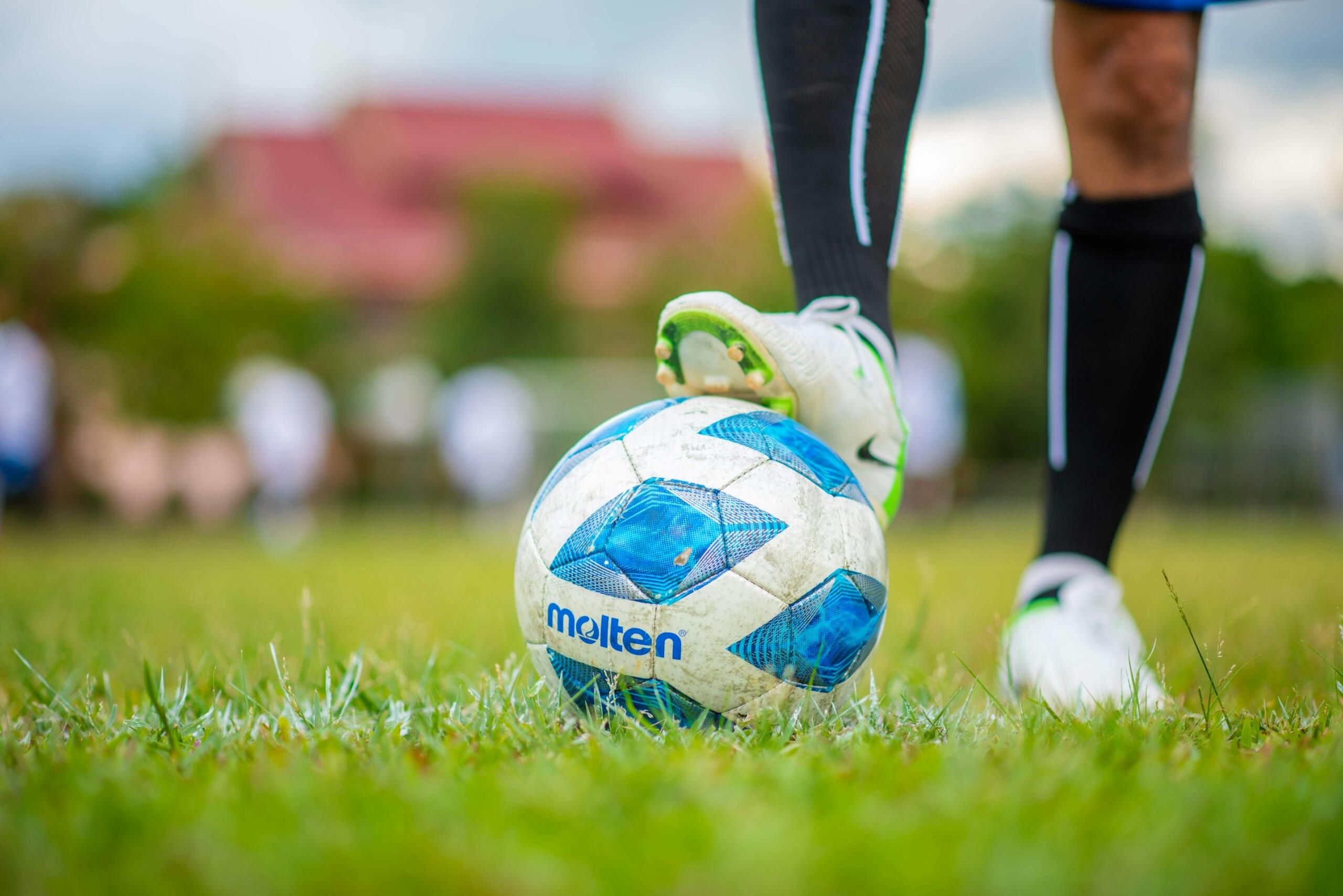 close-up-of-a soccer player's soccer boot on a soccer ball