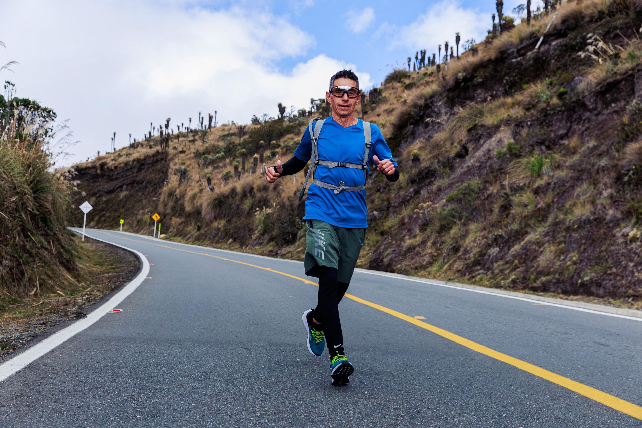 A runner charging downhill with strength.