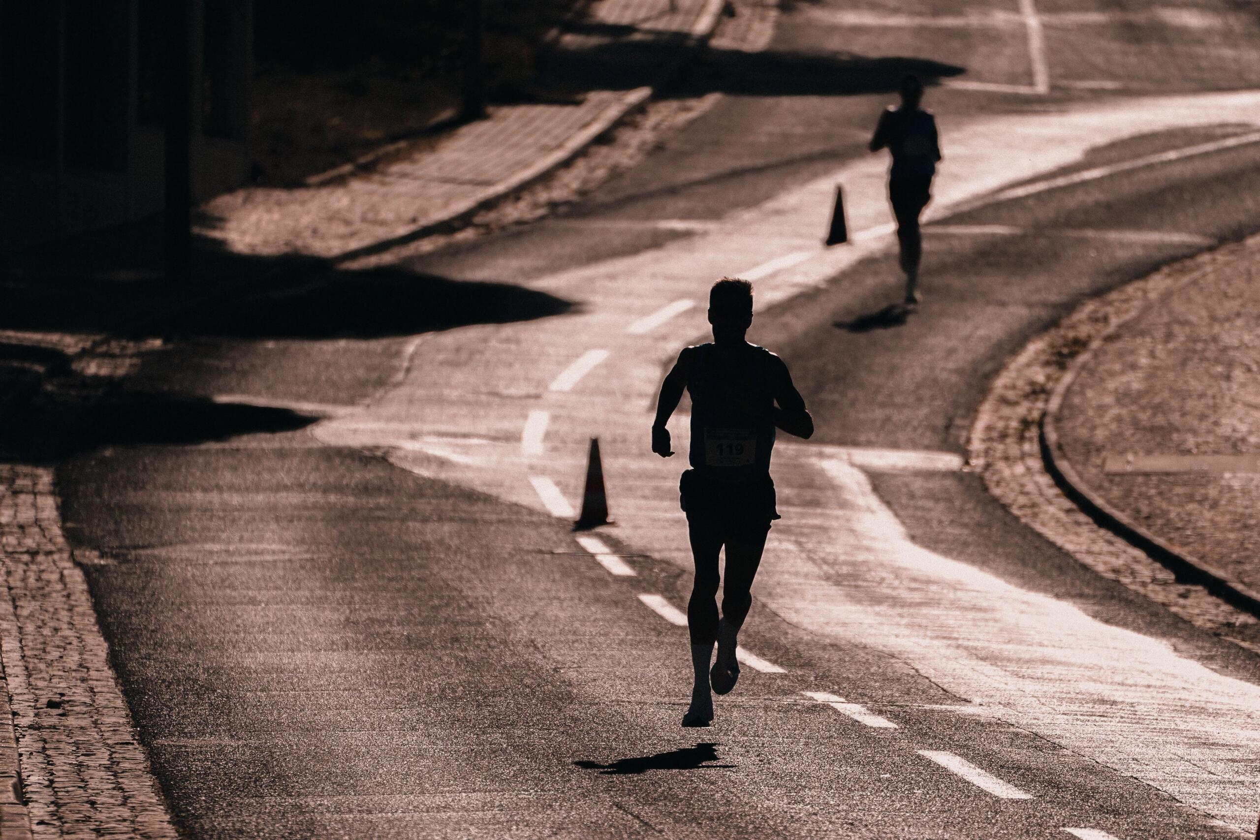 A silhouette of a road runner in a sepia-toned image.