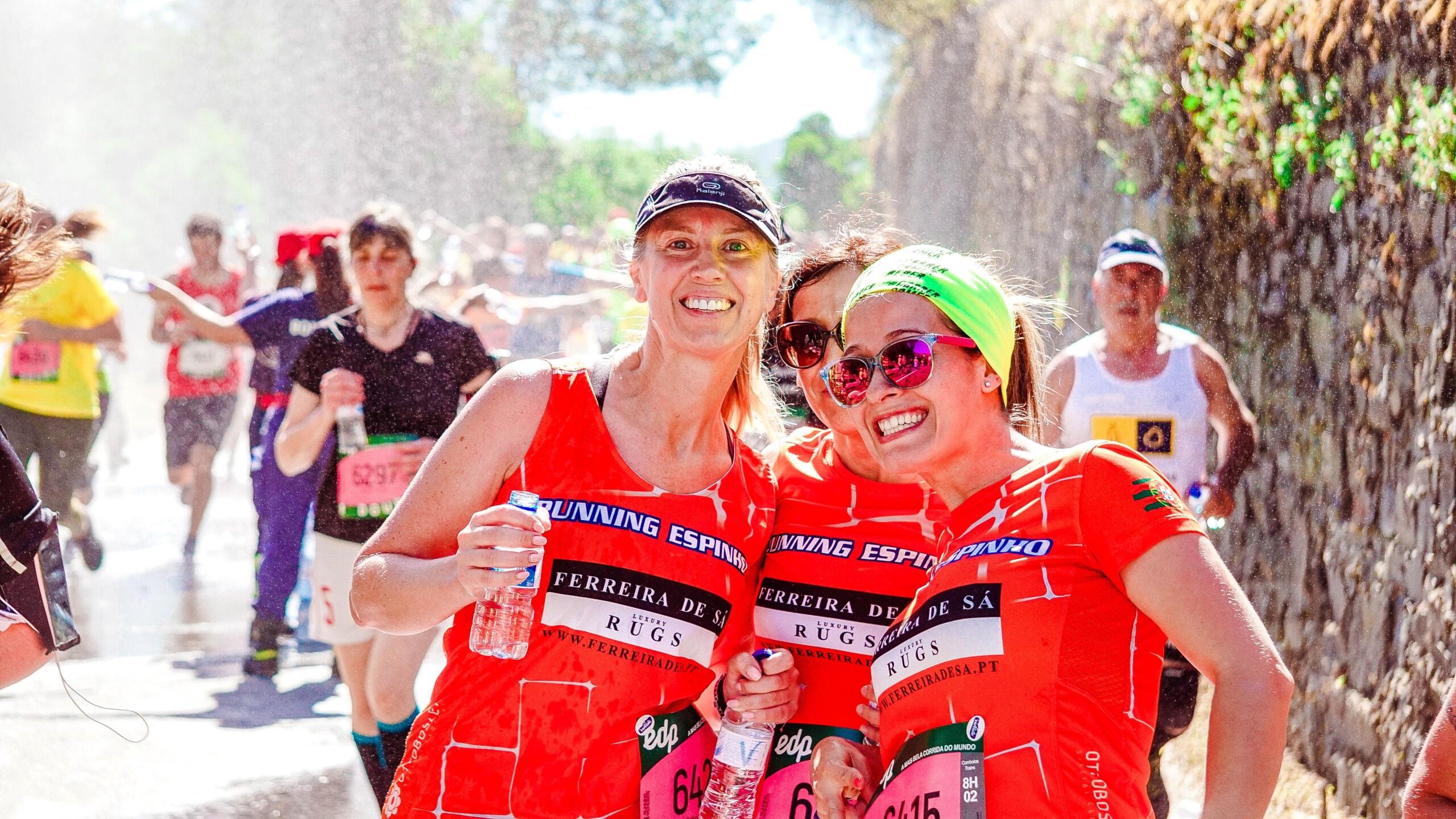 An image of running buddies taking a break at an event.