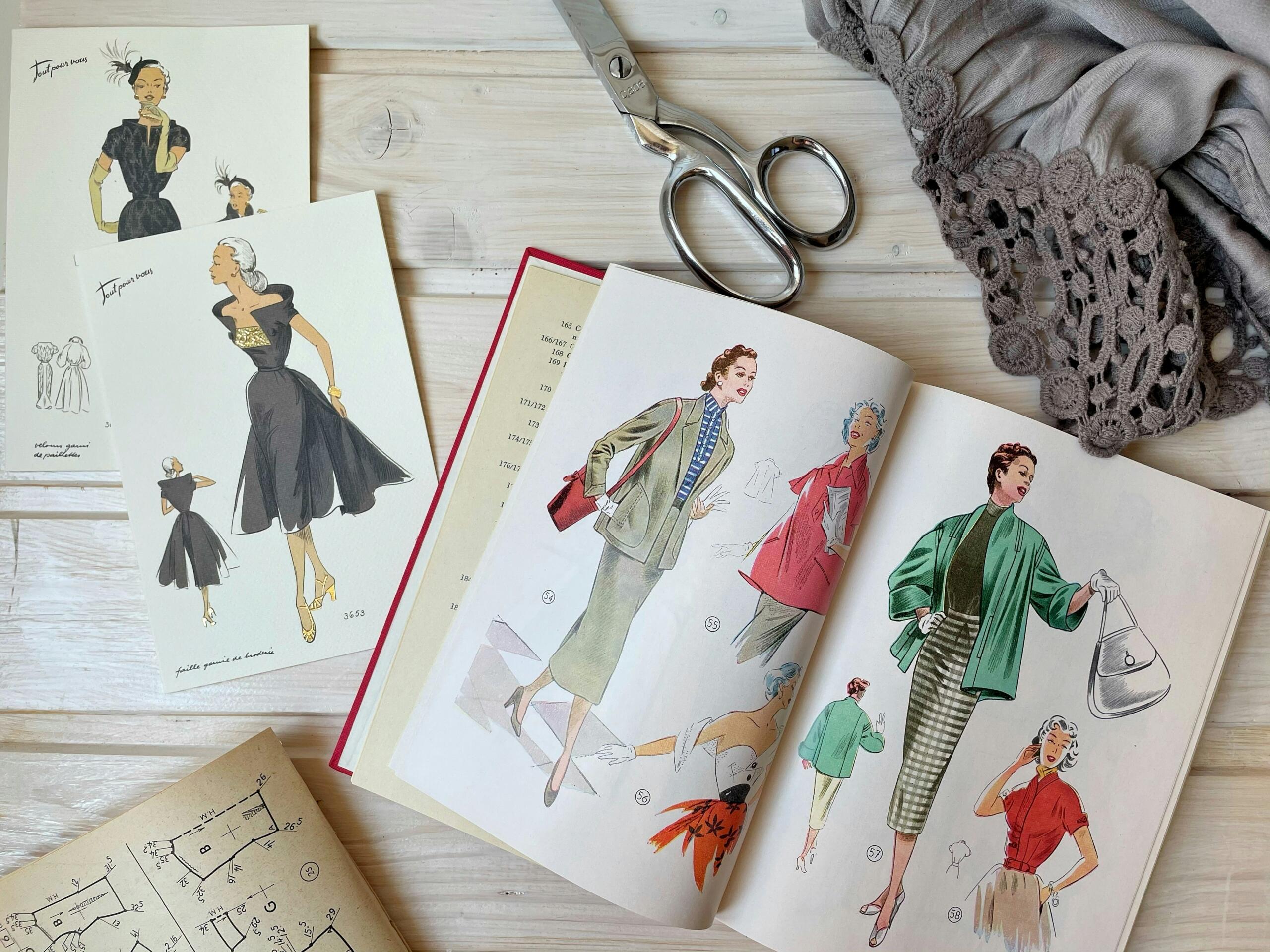An image of a fashion designer's drawings and tools.
