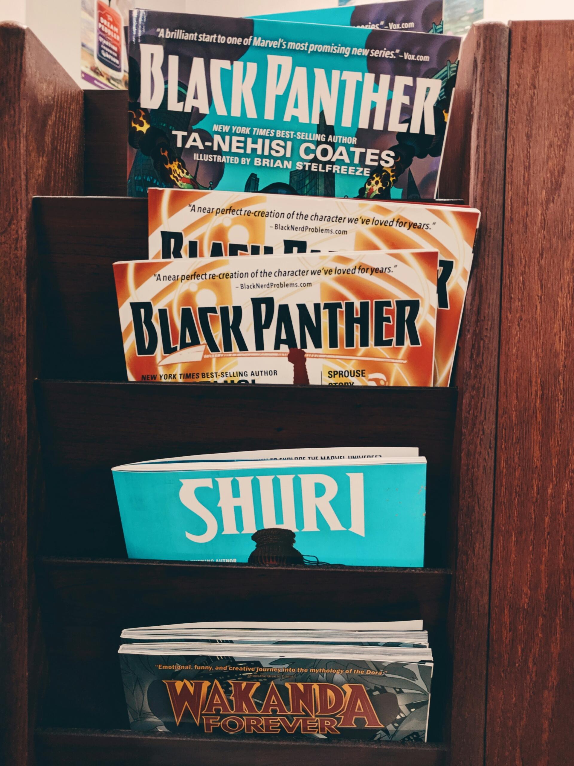 Stack of Black Panther books with a small book titled Shiri in the centre.