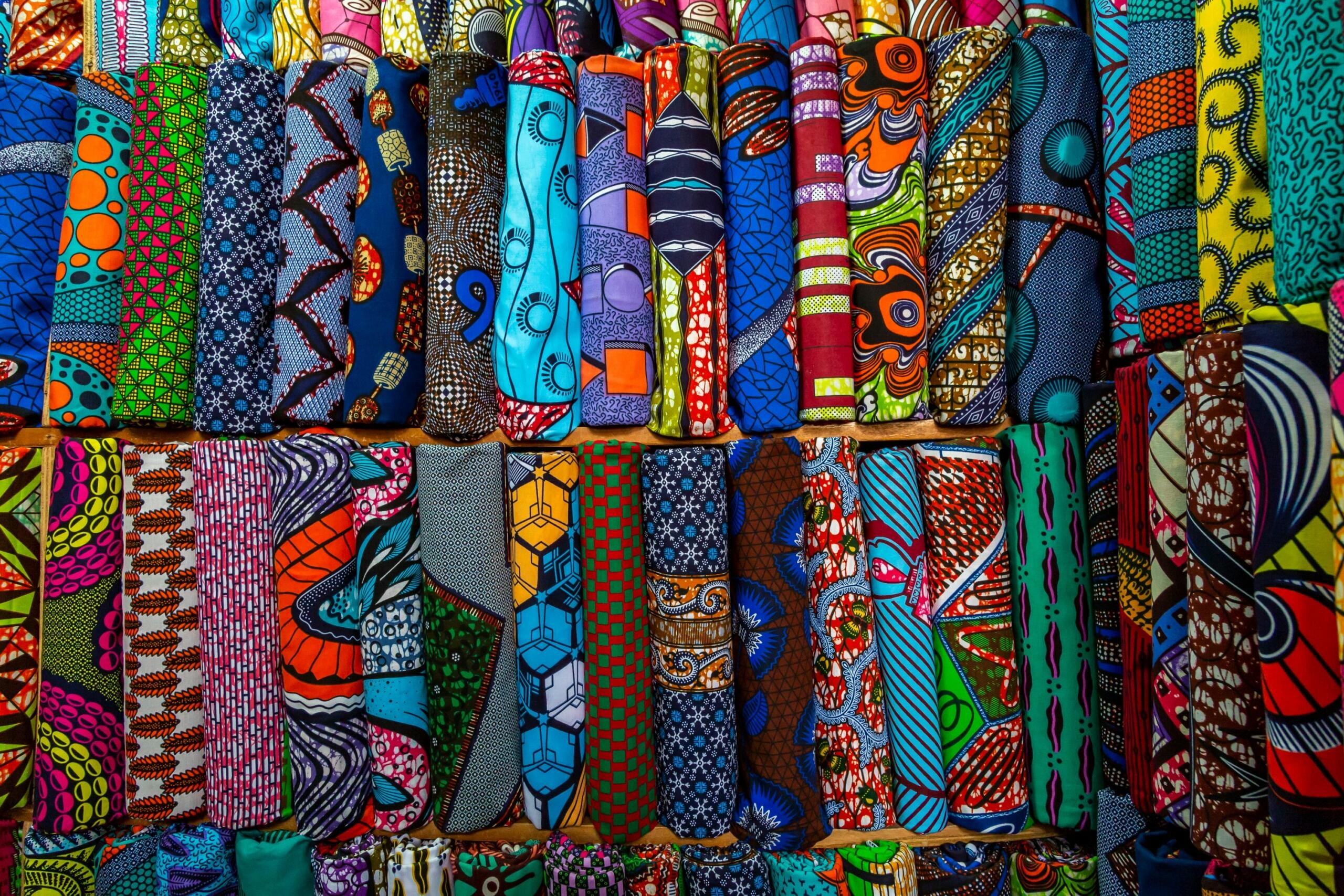 Differently rolls of fabric hanging together