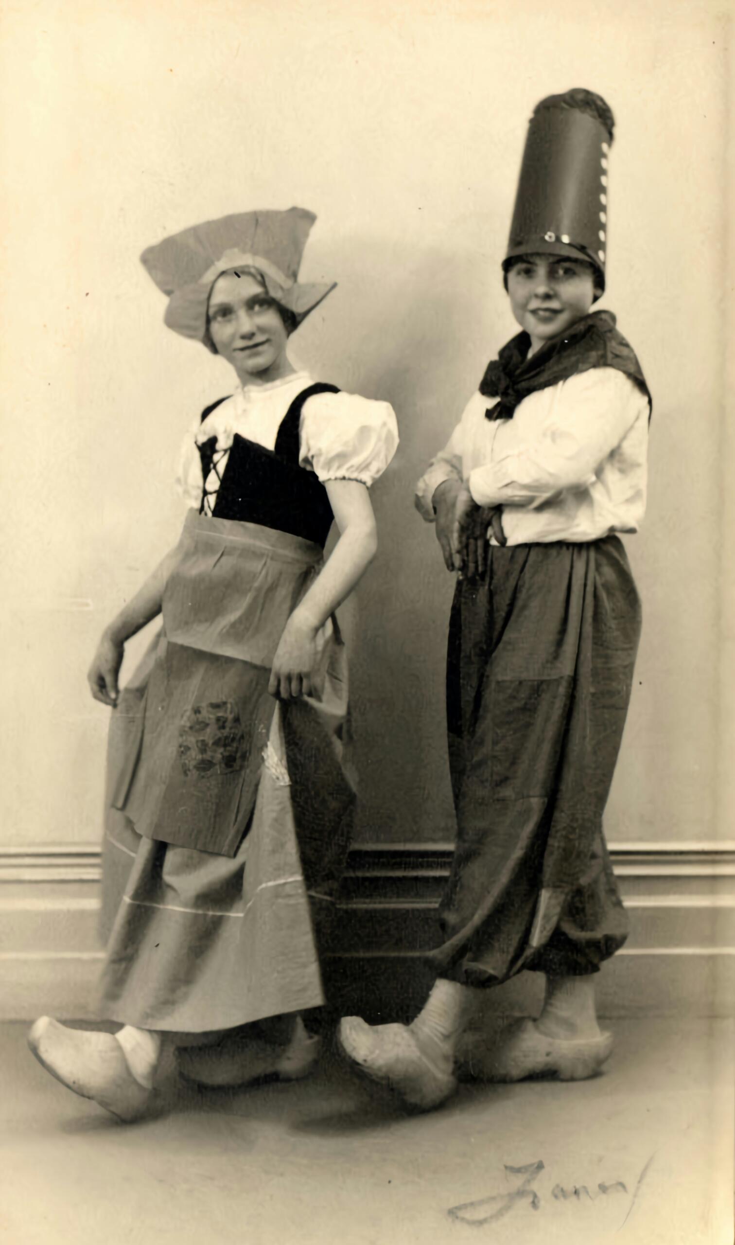 A vintage photograph of two people in traditional Dutch dress.