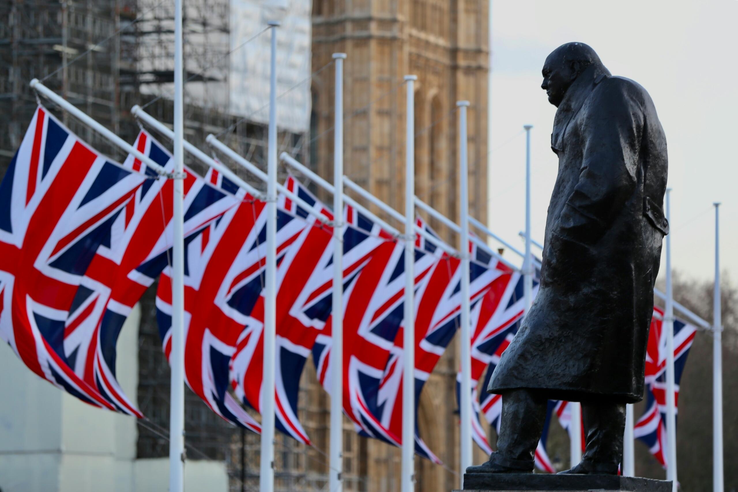 A row of British flags and a statue from Britain.