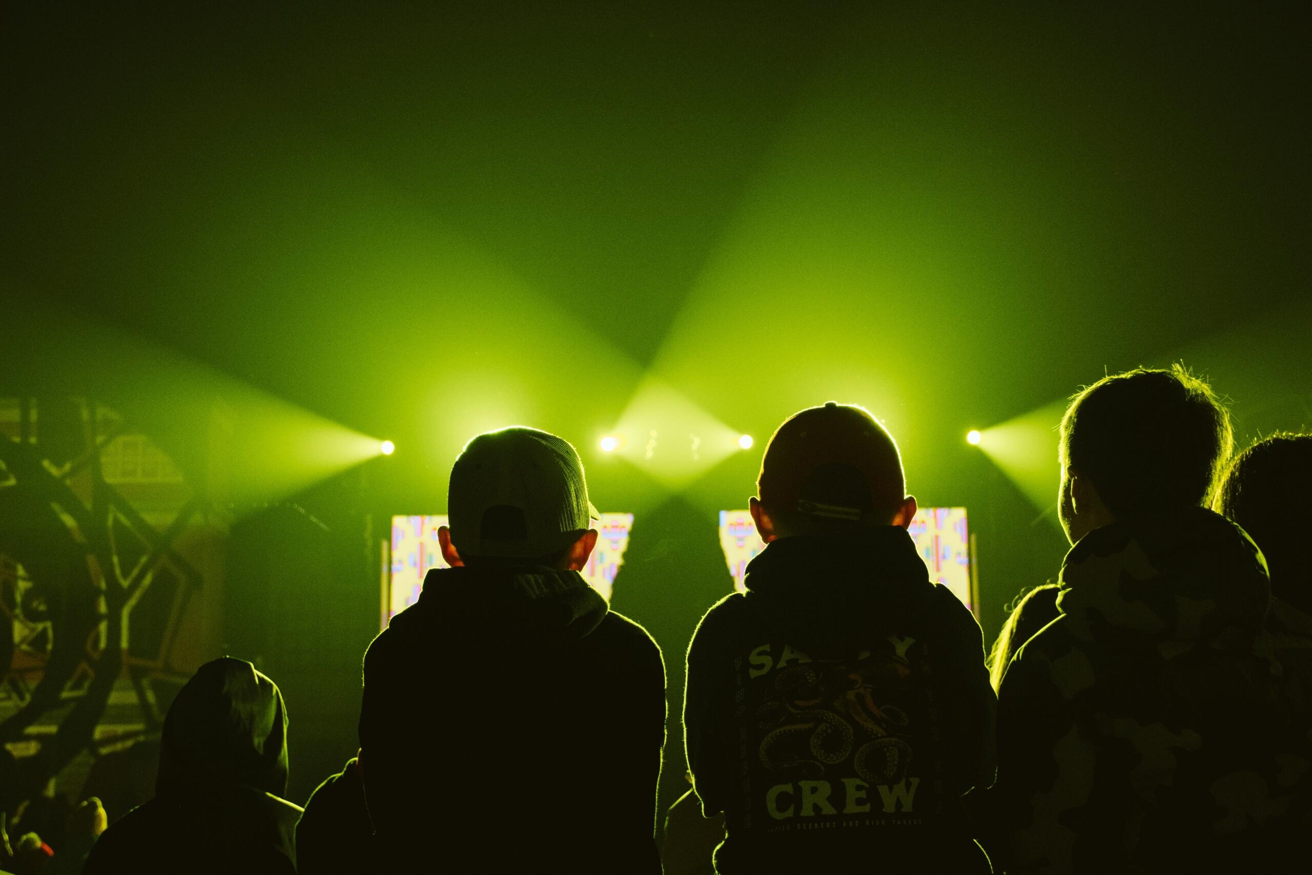 An image of children sitting in the light of a film projector